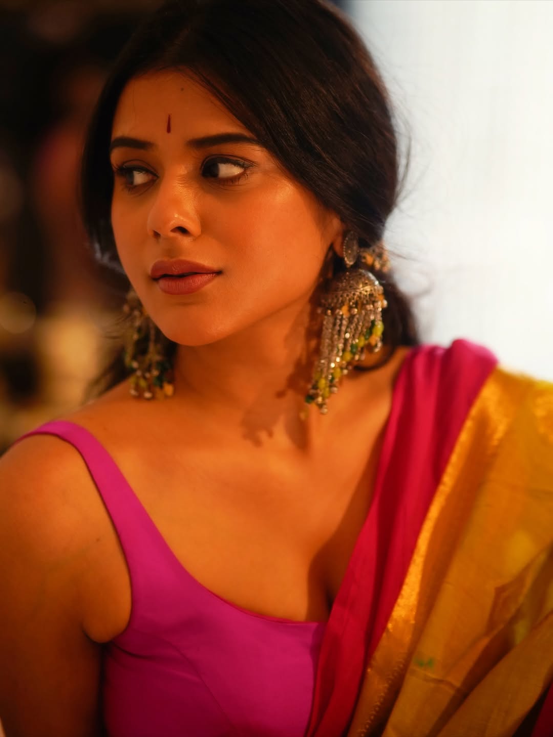 Nidhi Dudhraj's Bold Pink Sleeveless Blouse