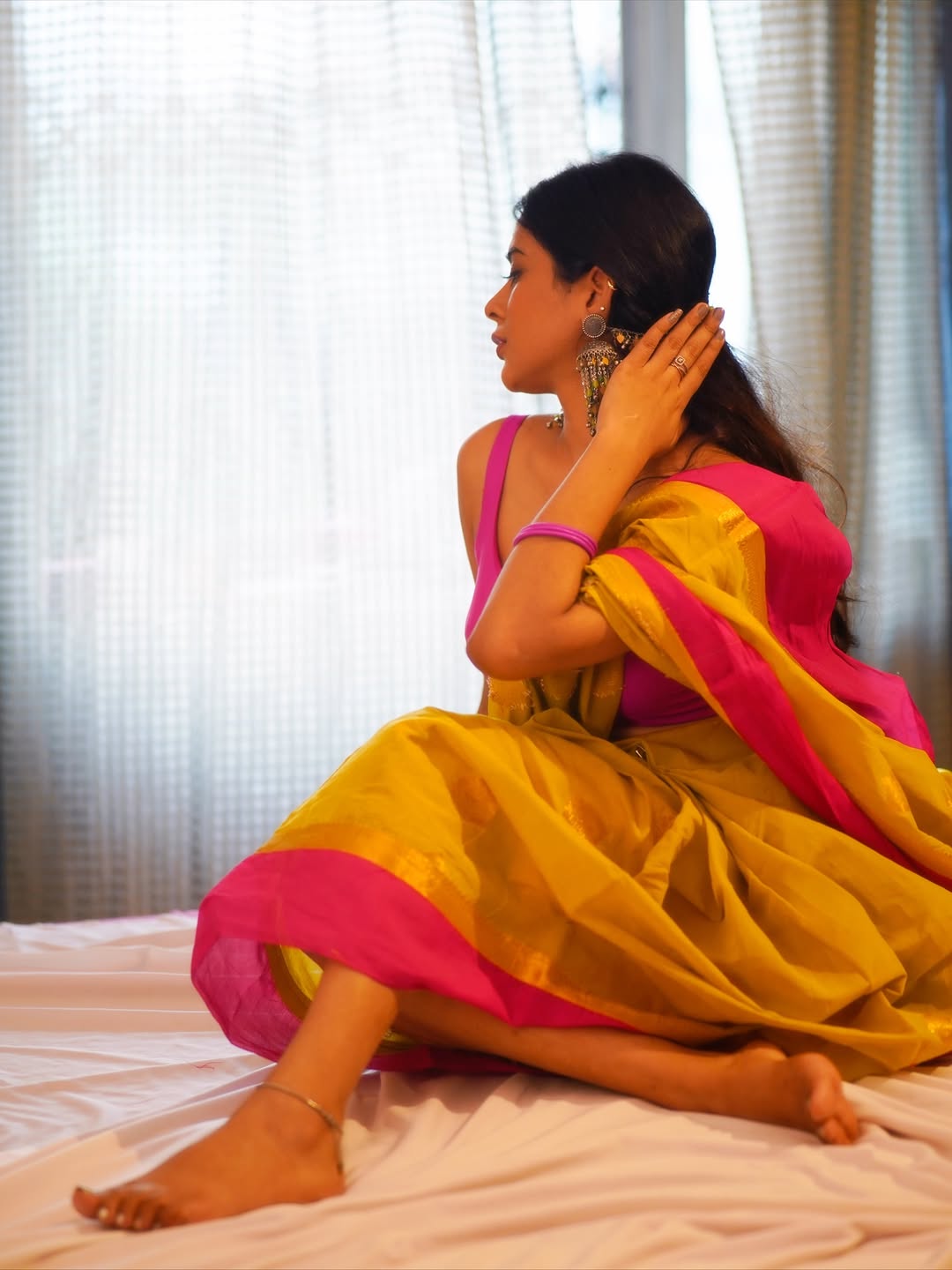 Nidhi Dudhraj Shows Off Her Back In Pink Blouse