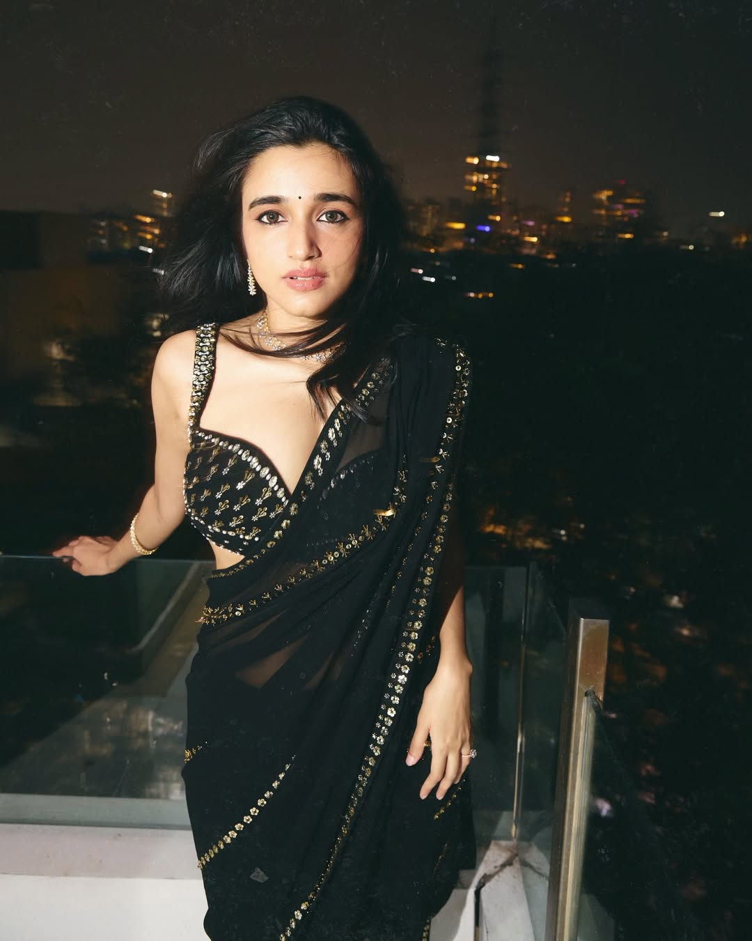 Nuveksha's Windswept Hair And A Sultry Saree Pose