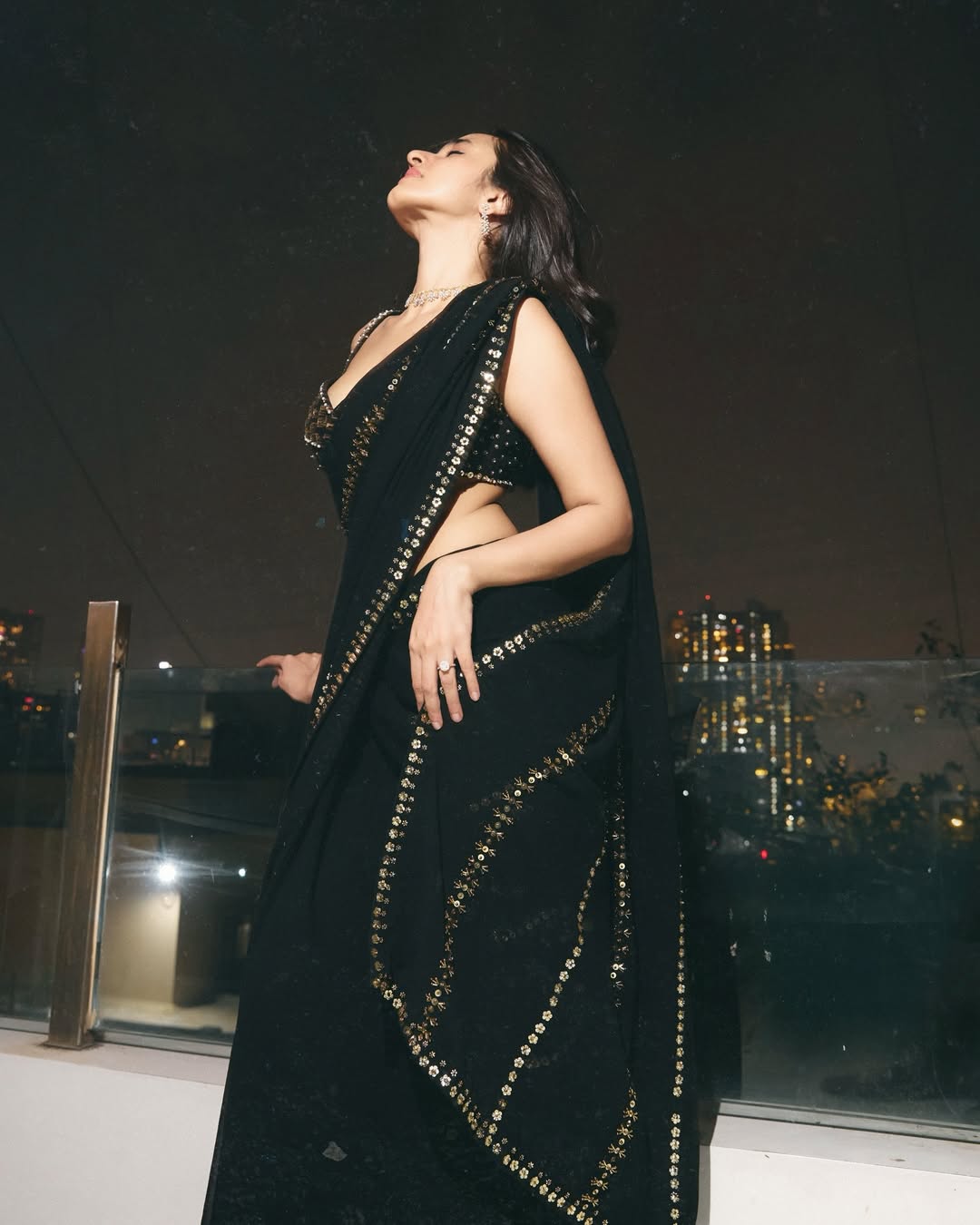 Nuveksha's Glamorous Night Photoshoot In A Saree