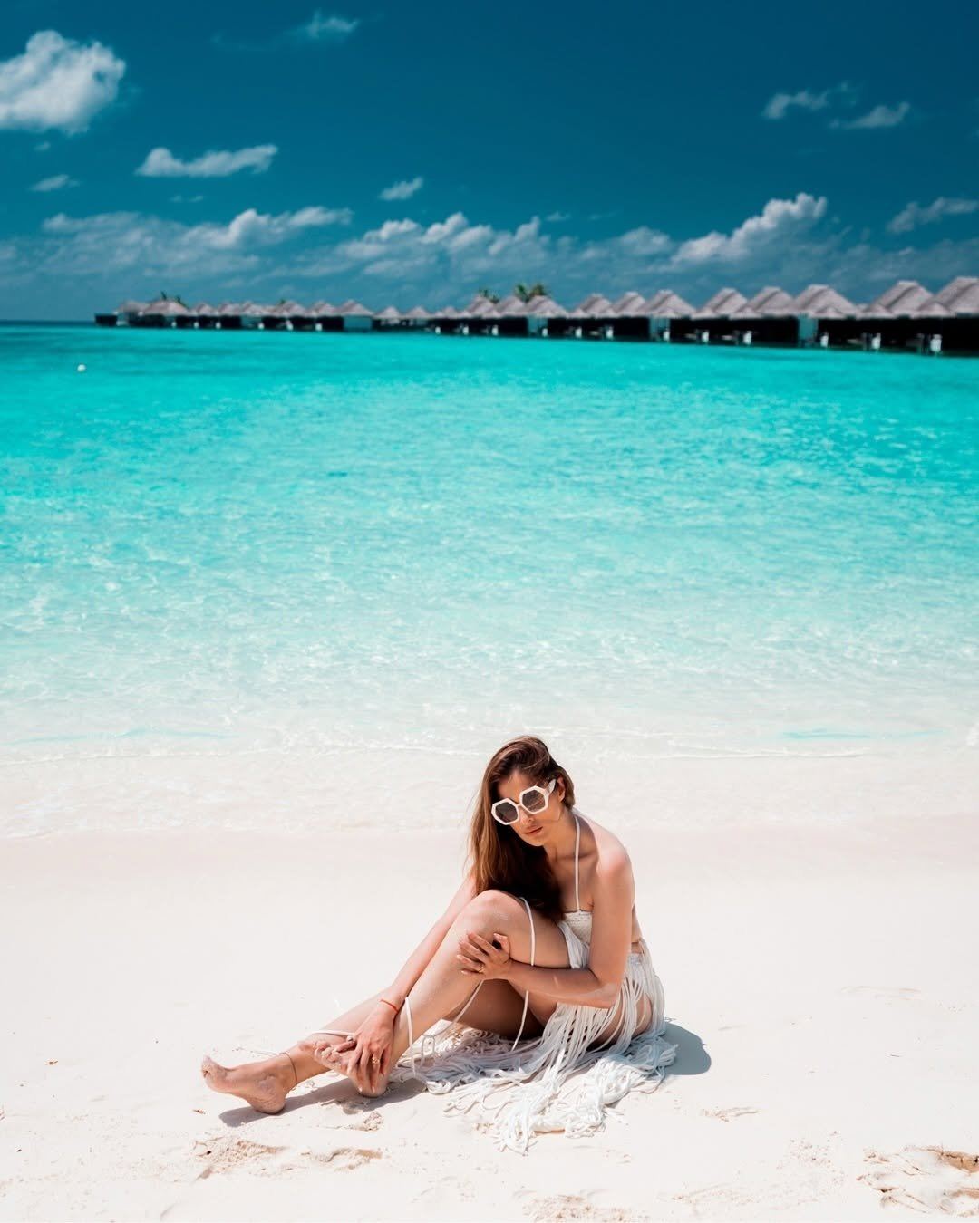 Raai Laxmi Plays With Sand In White Bikini Look