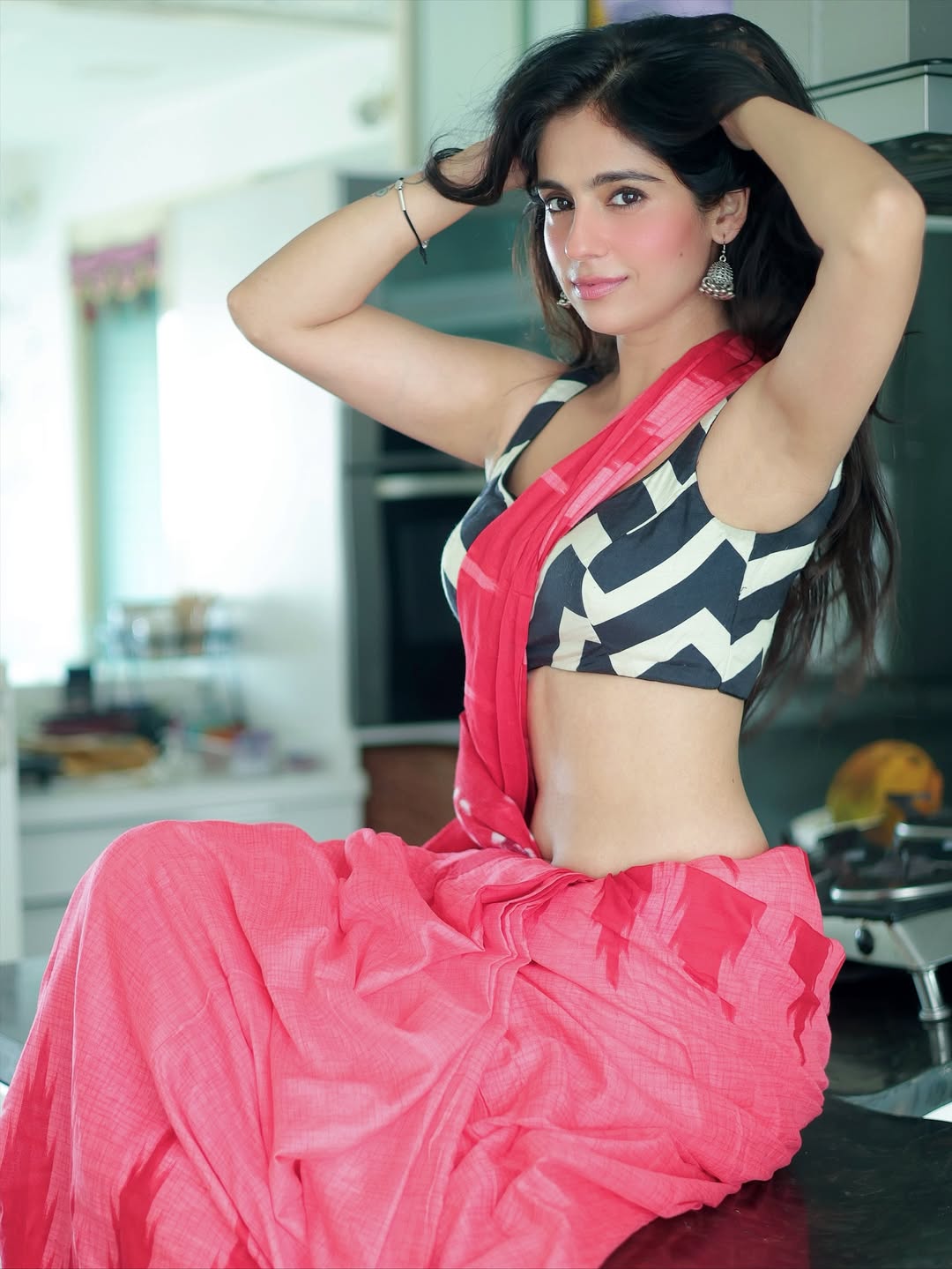 Rose Sardana Poses In A Pink Saree On Counter
