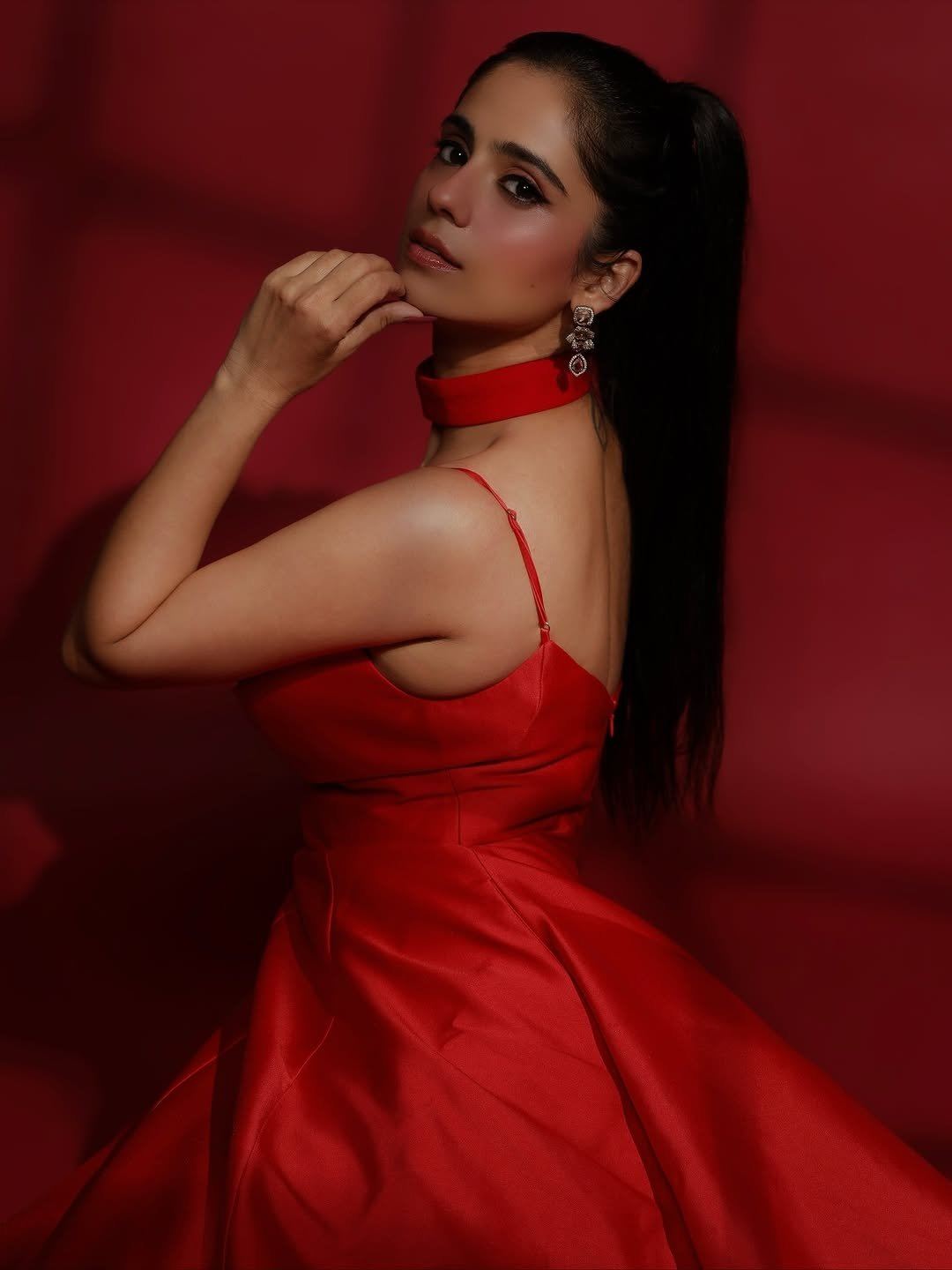Rose Sardana Flaunts Her Curves In Plunging Red