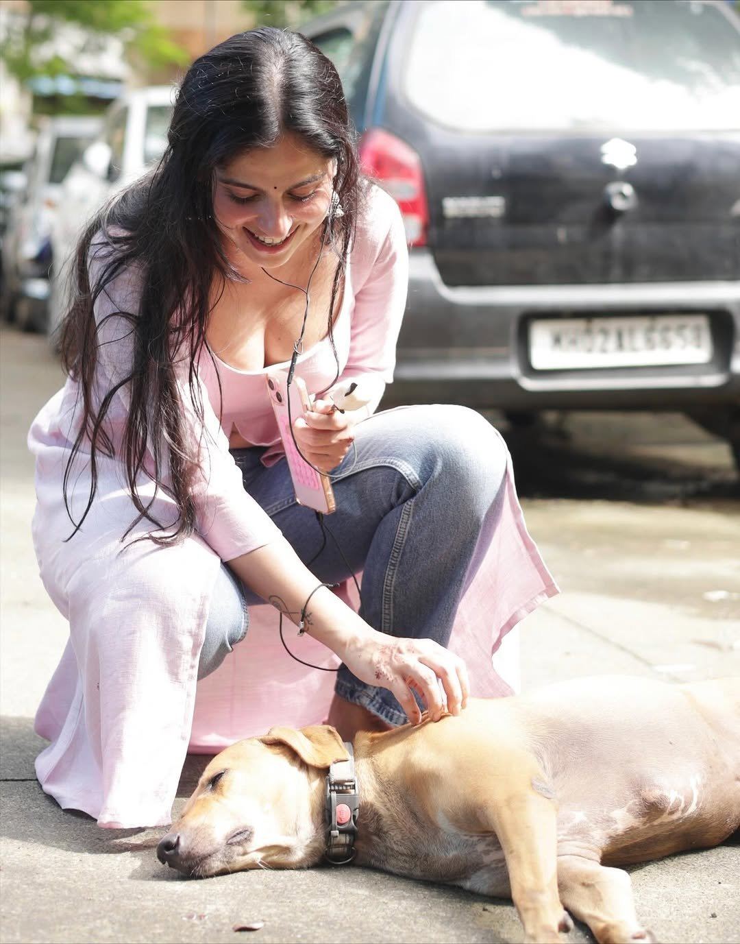 Rose Sardana Pets A Cute Dog On The Street