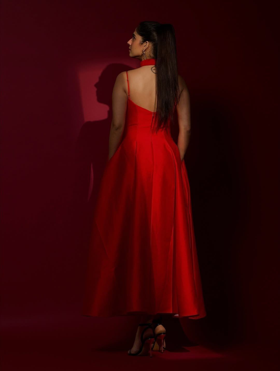 Rose Sardana Poses Backless In A Bold Red Gown