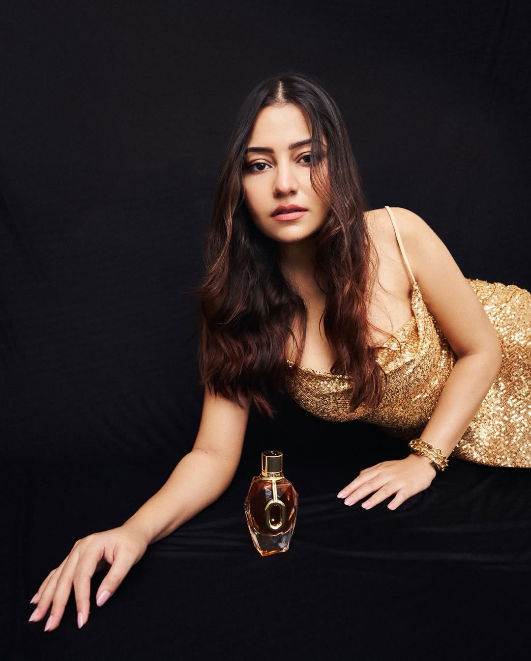 Simran Kaur Lying Down On A Black Backdrop
