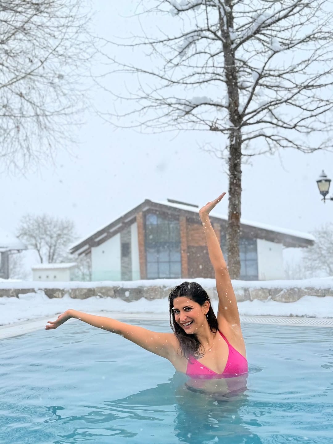 Aahana Kumra Catching Snowflakes In Swimwear!!
