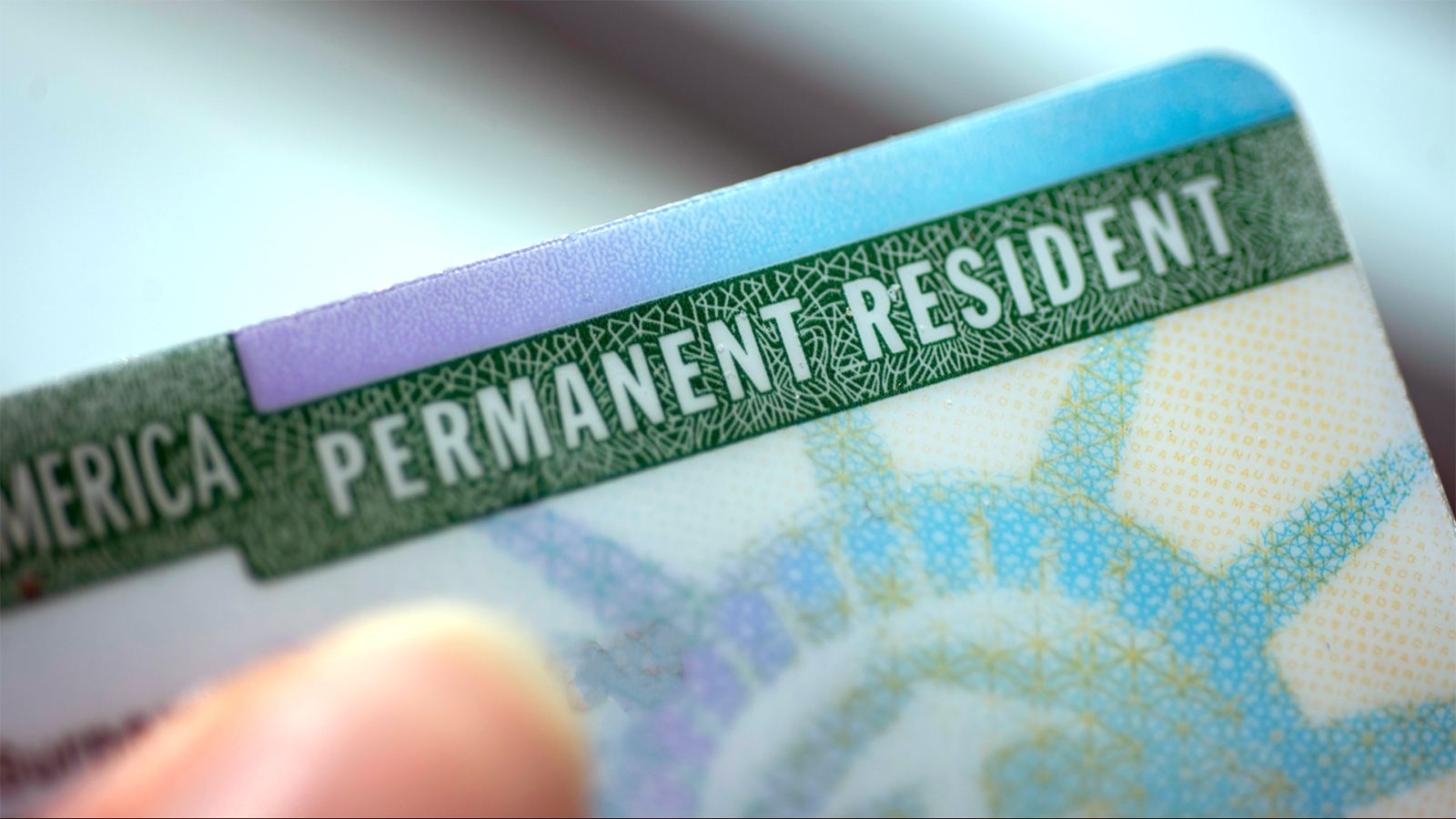 Couple stuck in green card delay battle