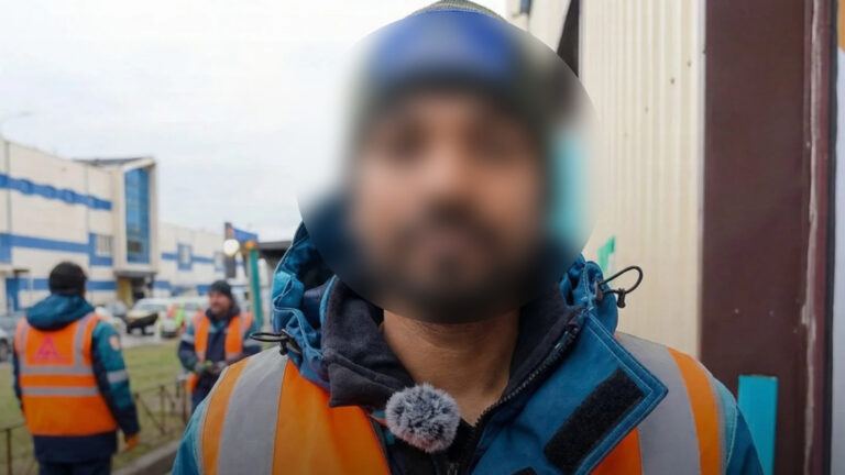Indian worker sweeping streets in Russia