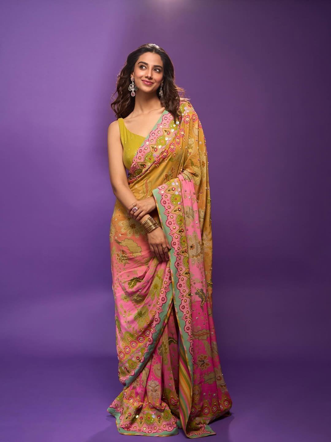 Meenakshi Chaudhary Poses Boldly In Yellow Saree