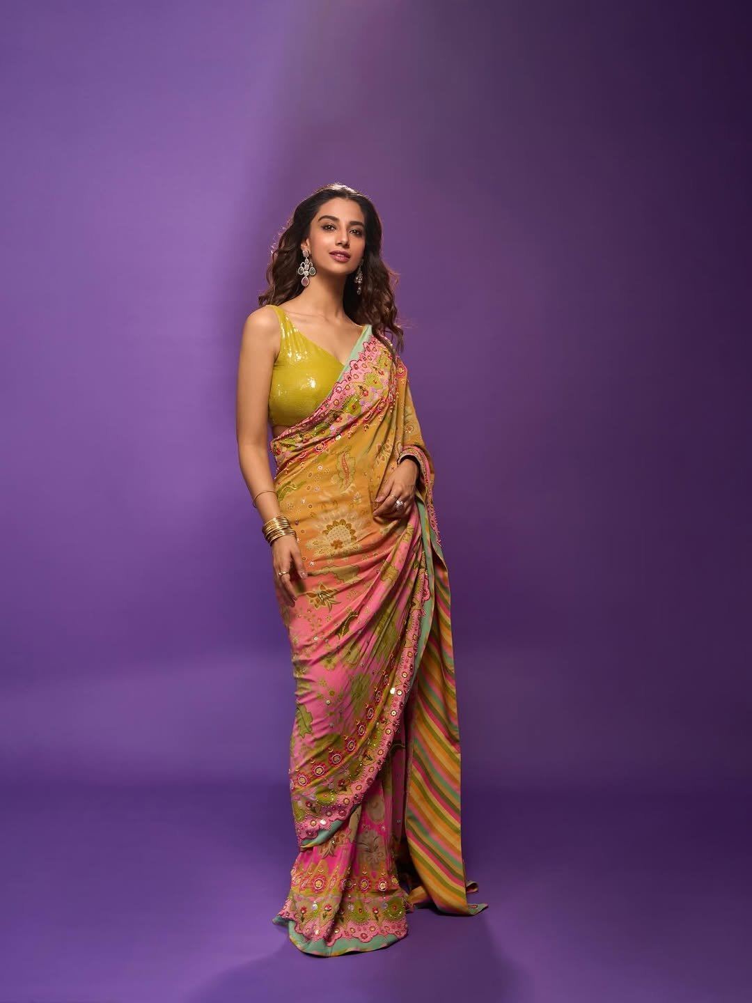 Meenakshi Chaudhary Smiles In Yellow Floral Look