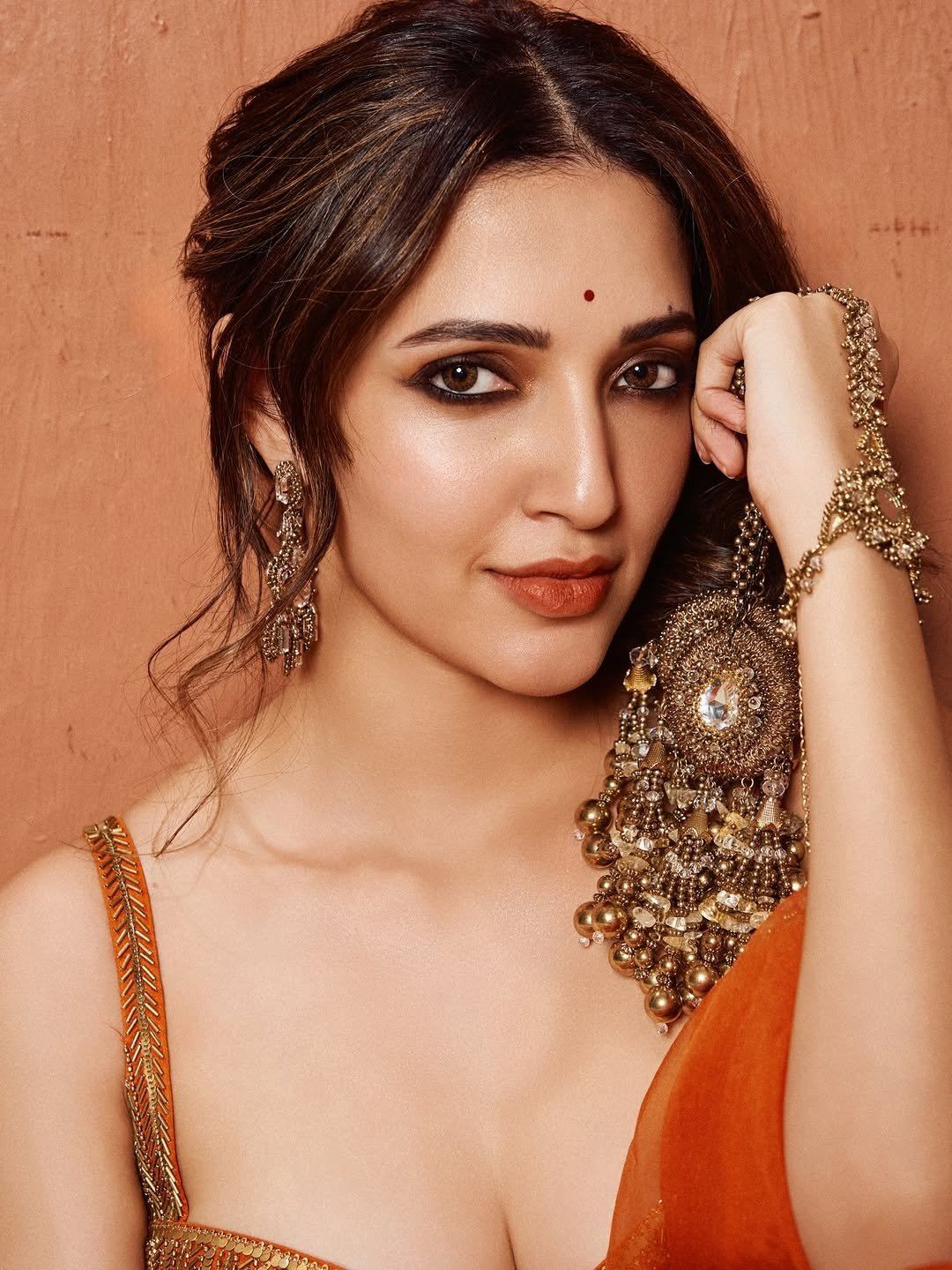 Neha Shetty's Bold Pose In Orange Lehenga Set