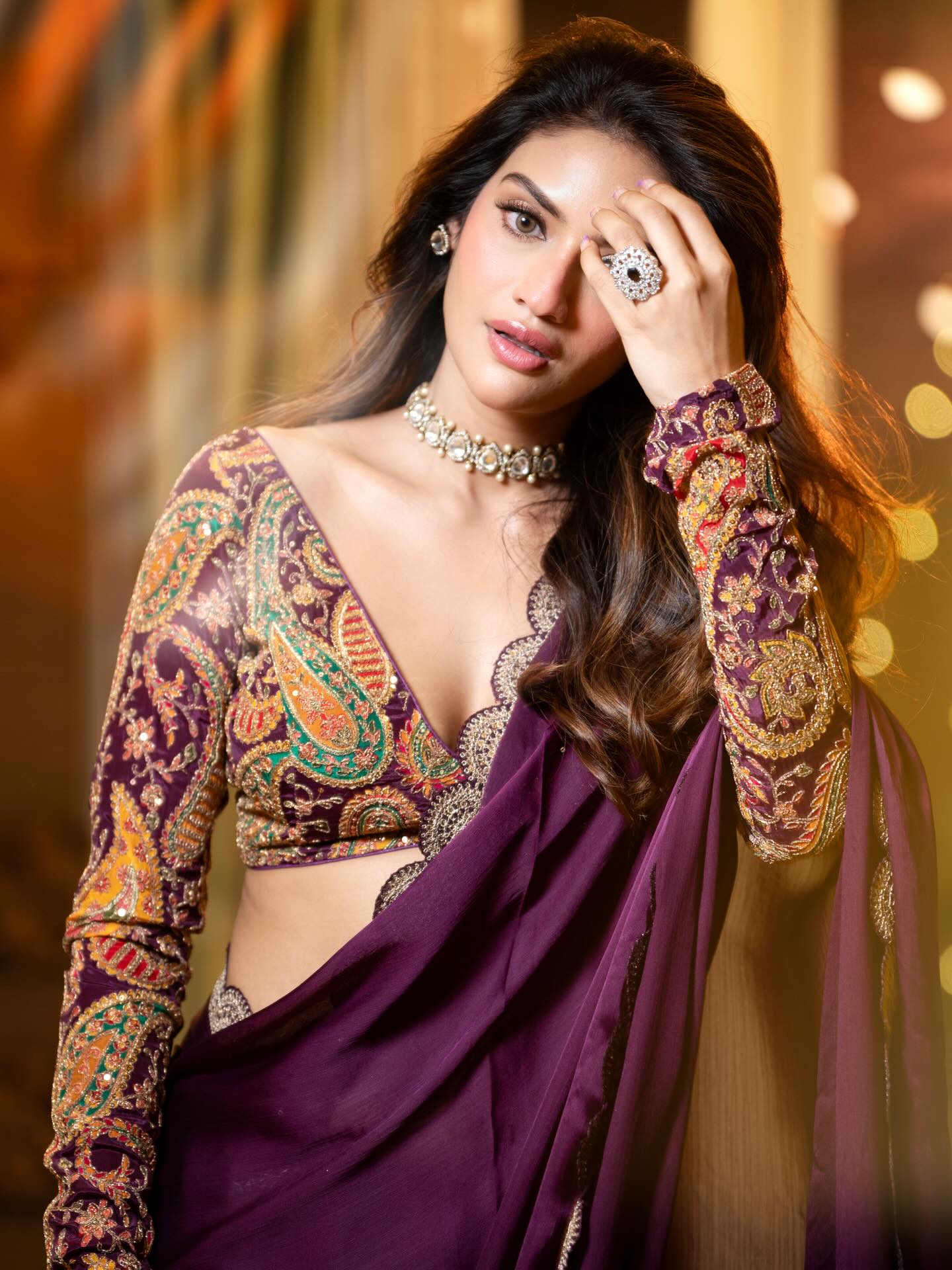 Nussrat Jahan Poses Boldly In Wine Saree