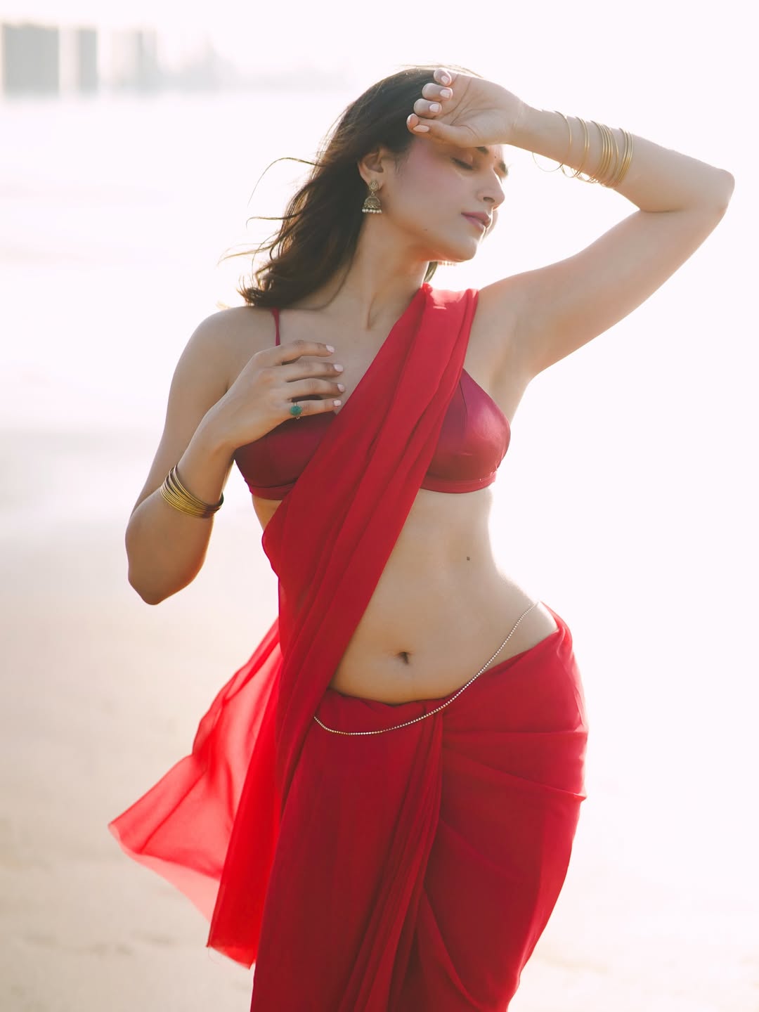 Prisha Singh Flaunting Curves In Red Saree Photo