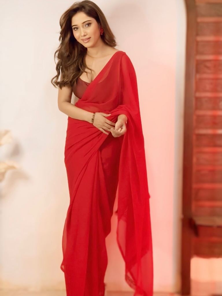 The Red Saree Hugs Her Curves Perfectly
