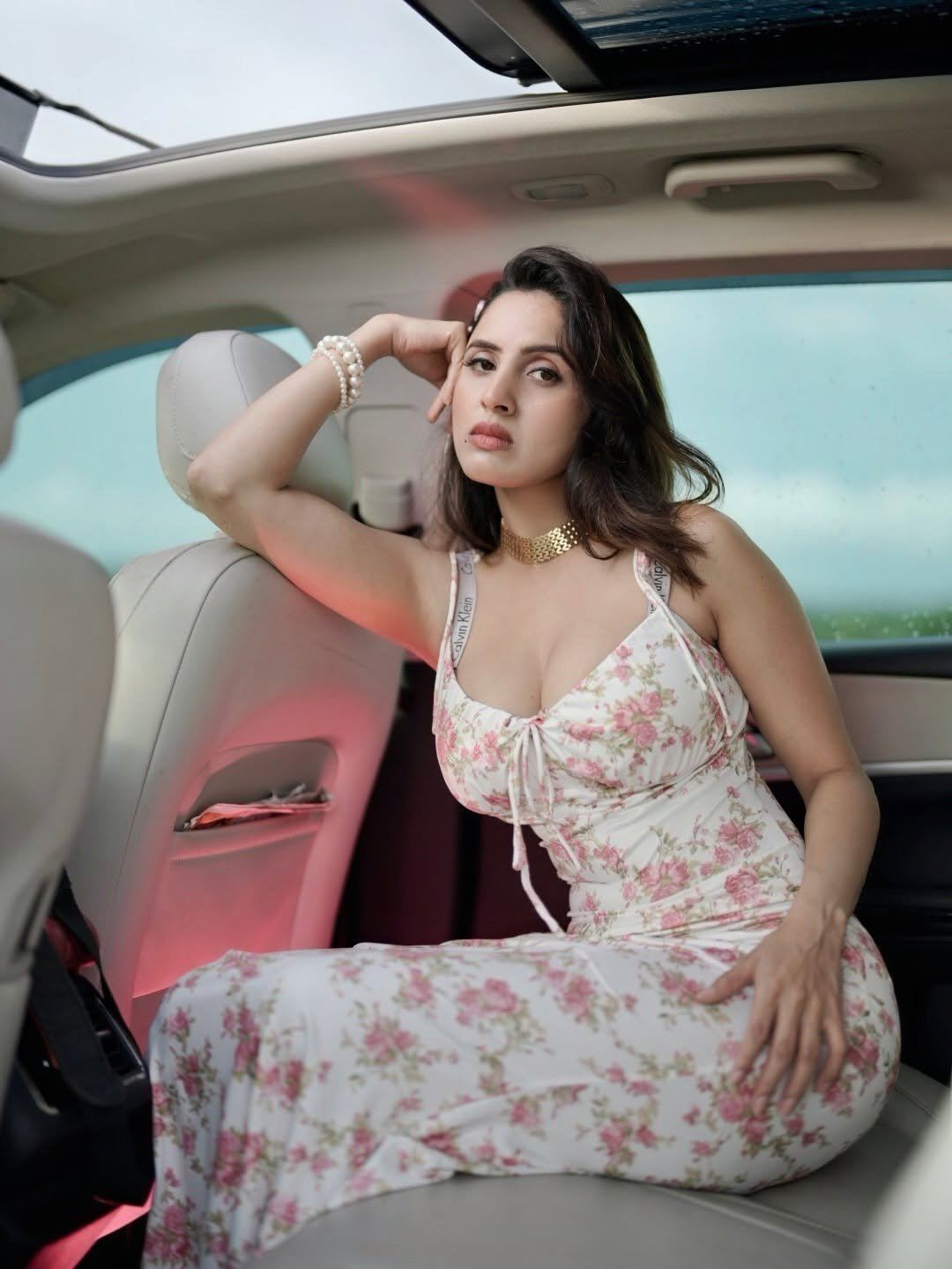 The White Floral Dress Hugs Her Curves Perfectly