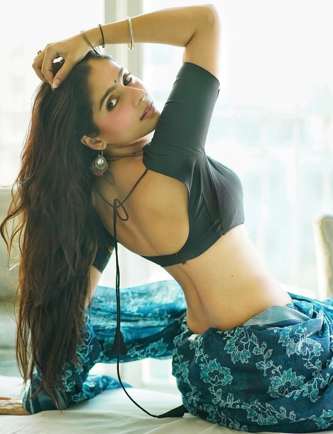 Close Up Of Rose Sardana's Om Tattoo On Back