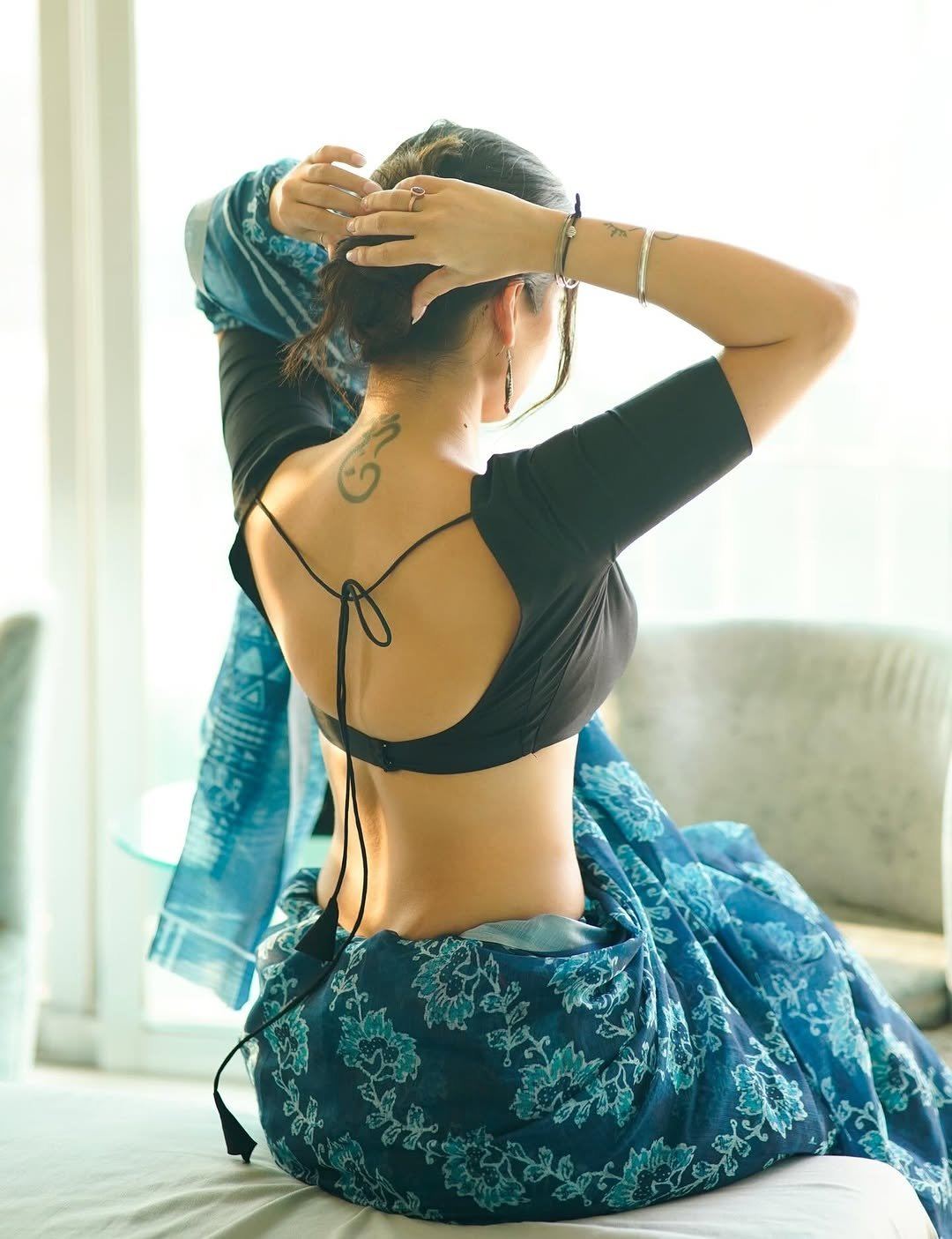 The Actress Flaunts Her Backless Black Blouse