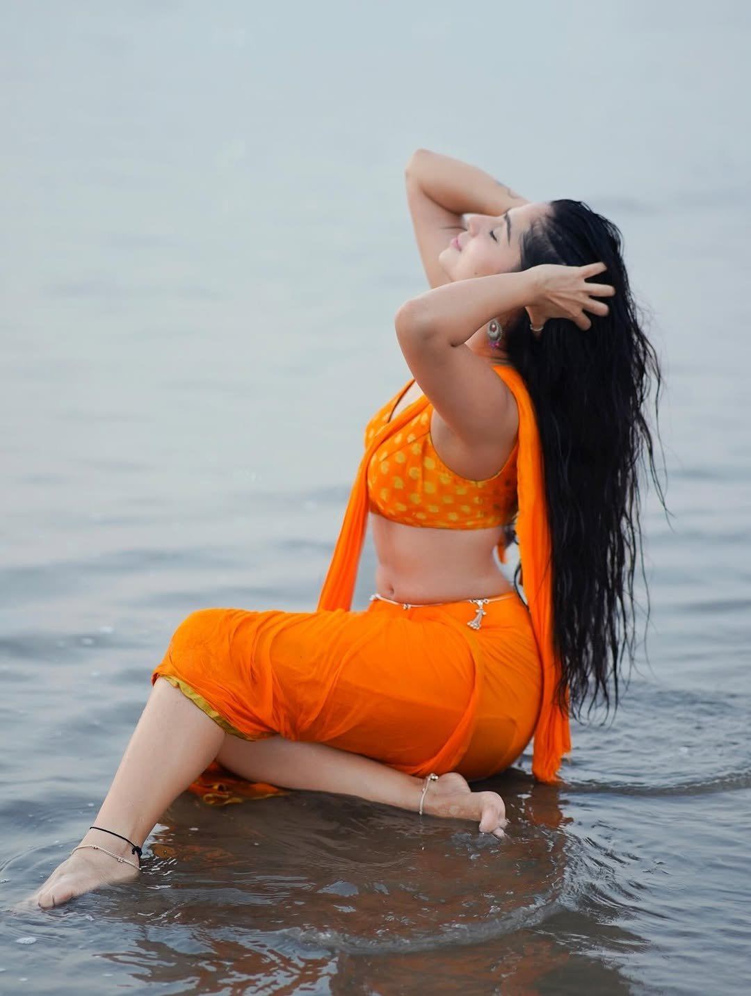Rose Sardana Sits Gracefully In Sea Water Waves Set