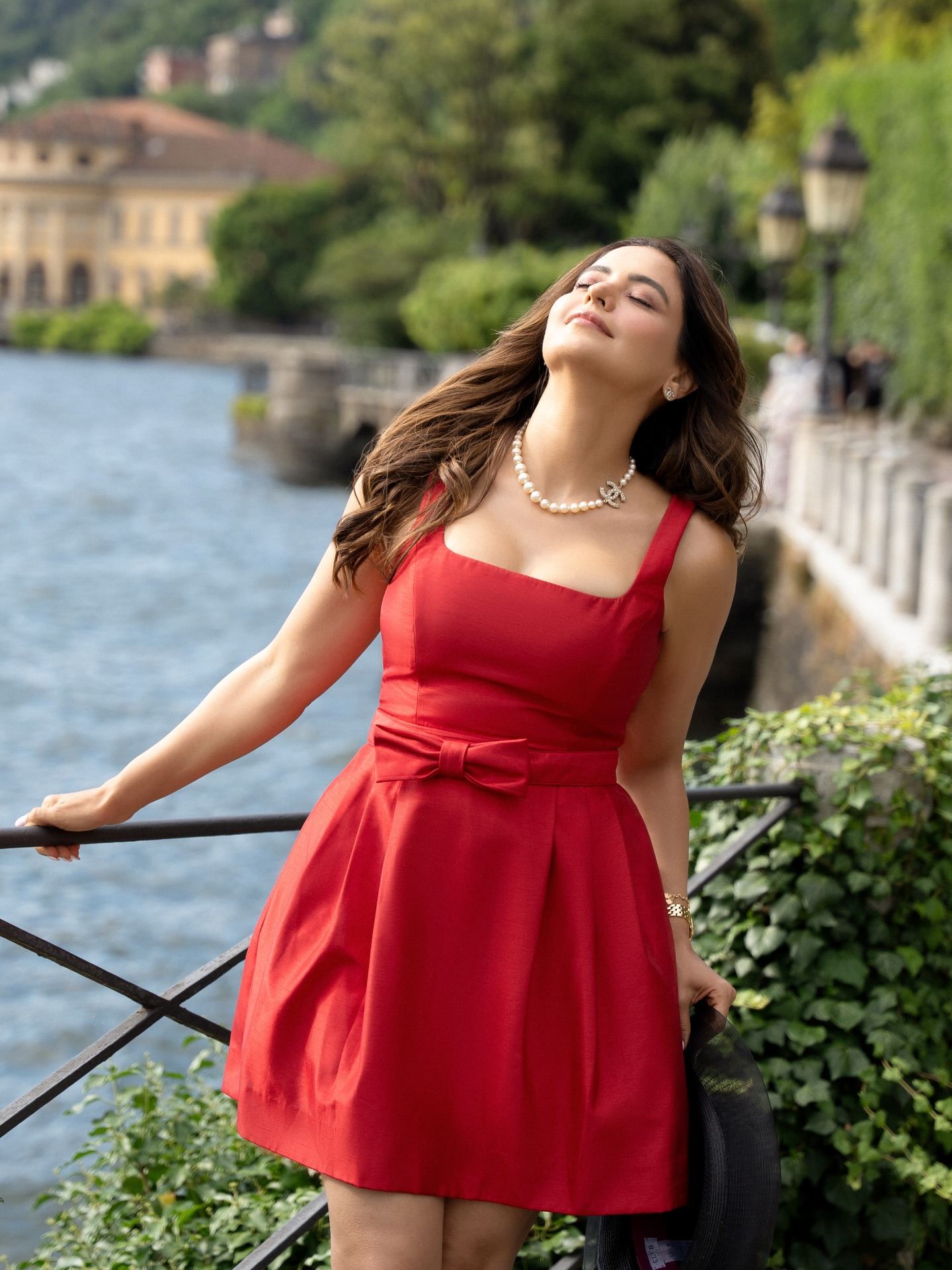 Aamna Sharif posing in elegant red dress
