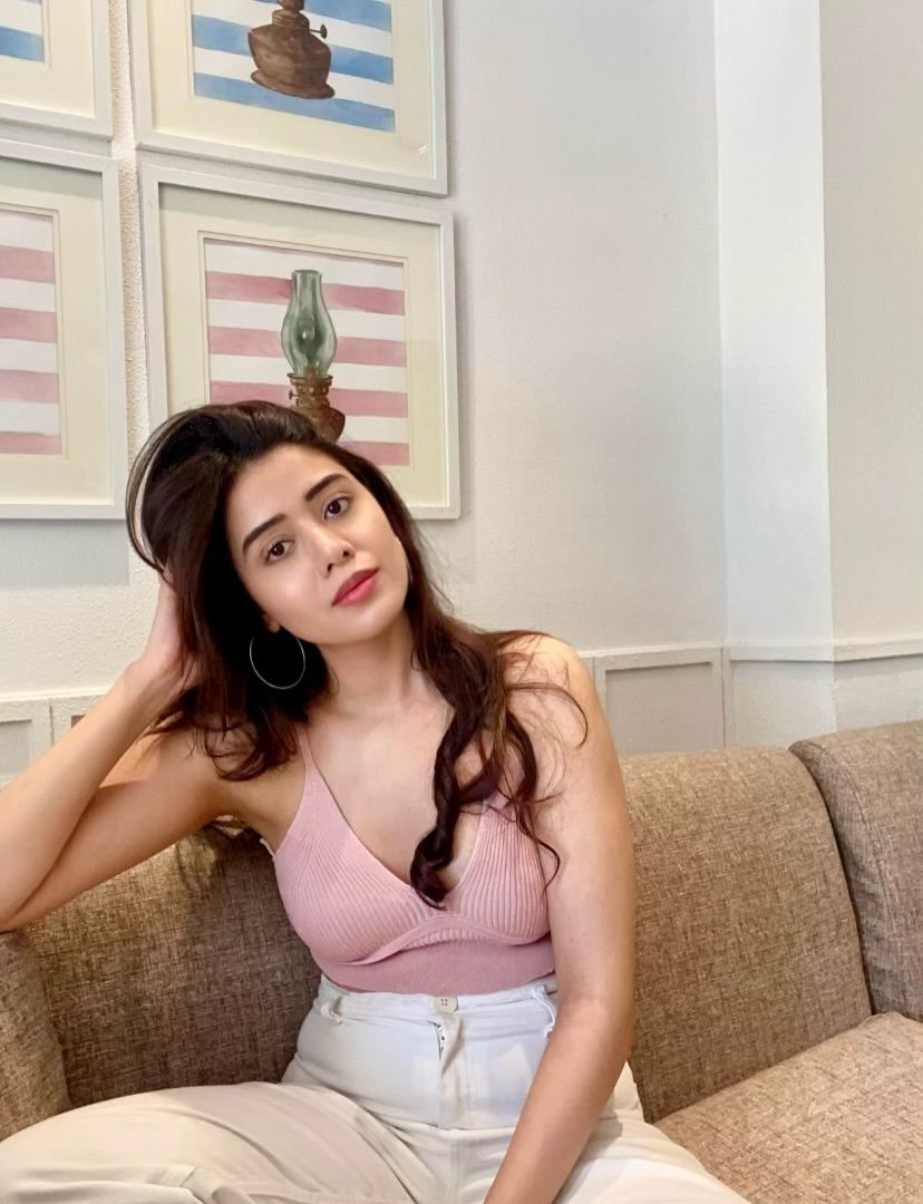 Aarti Chikata In Soft Pink Top With Relaxed Pose