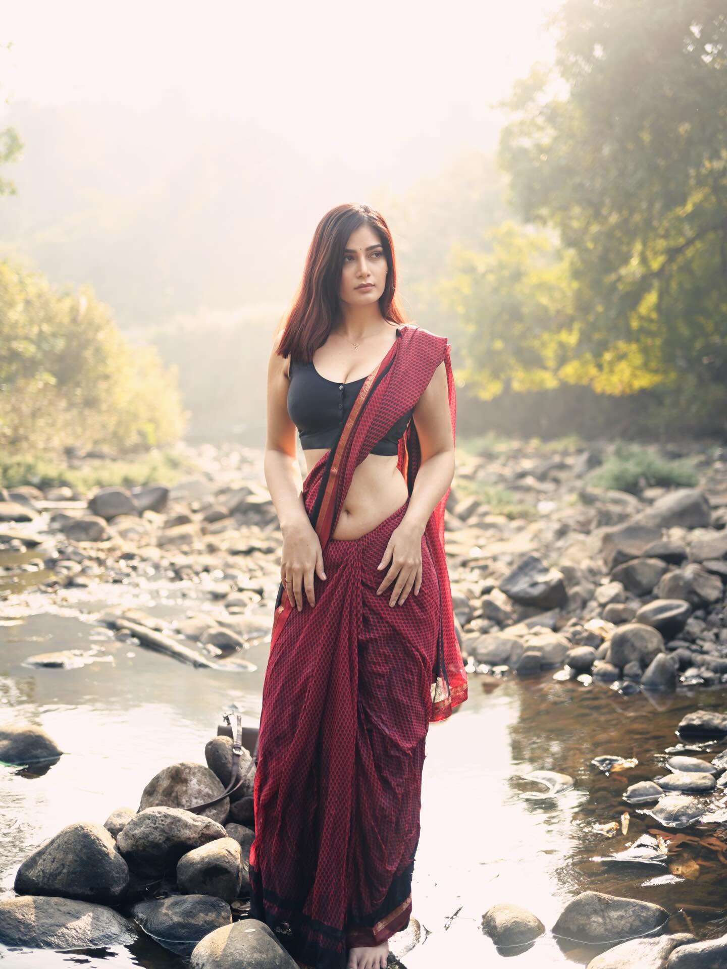 Advika Sharma Poses Calmly In Flowing Red Saree