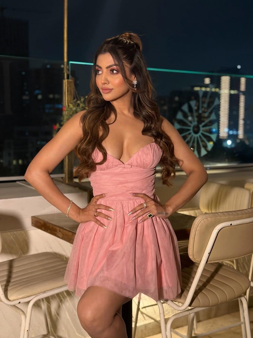 Akanksha Puri Posing In Bold Pink Mini Dress
