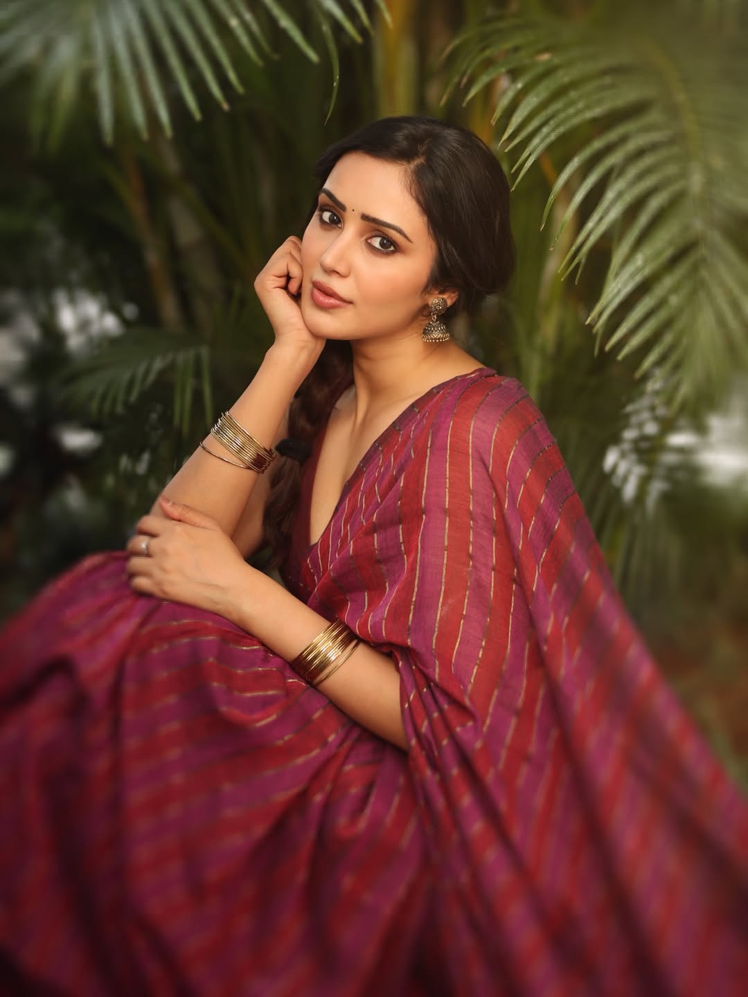Anaira Gupta Posing In Wine Colored Striped Saree