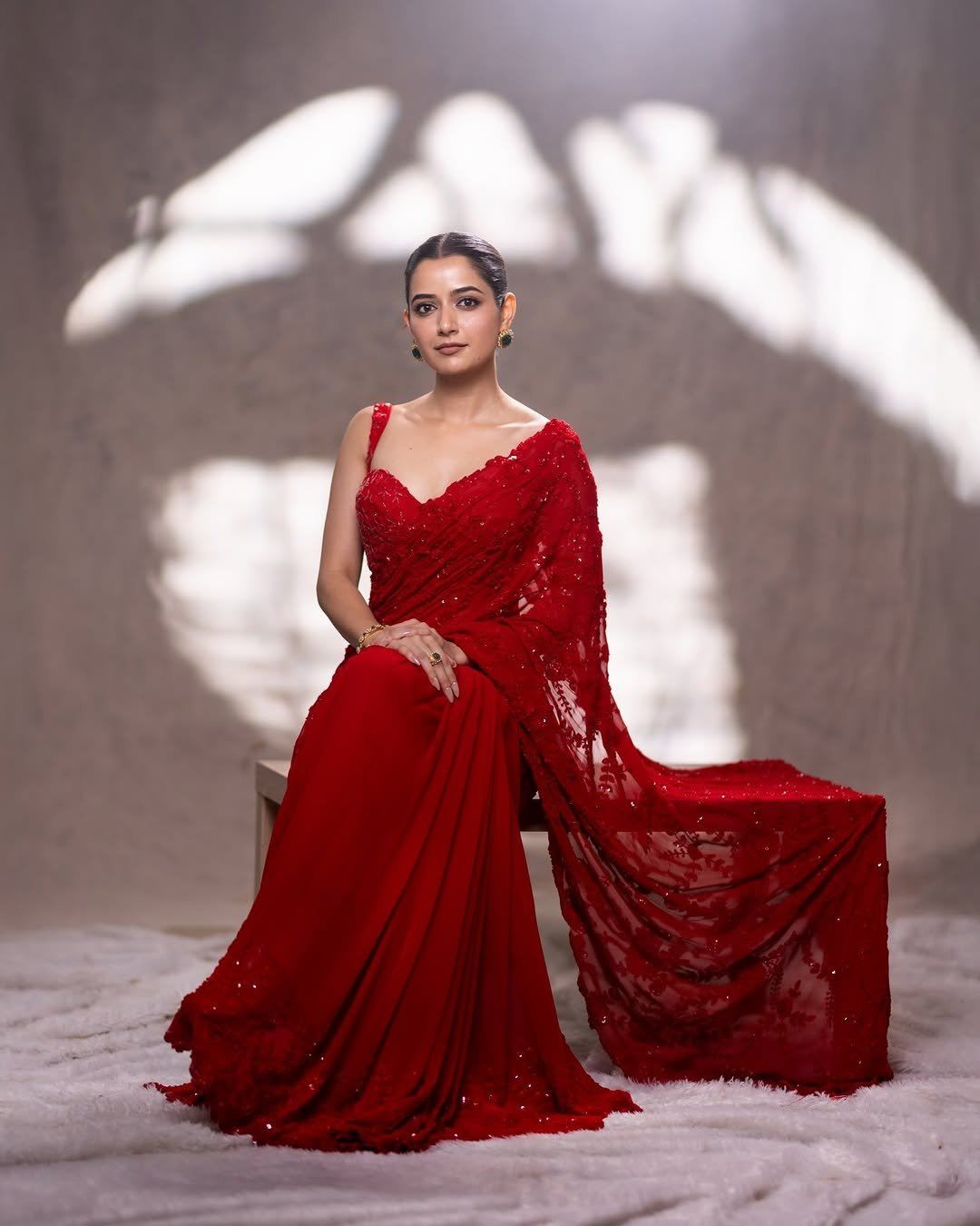 Ashika Rangnath In A Sleeveless Bold Red Blouse.