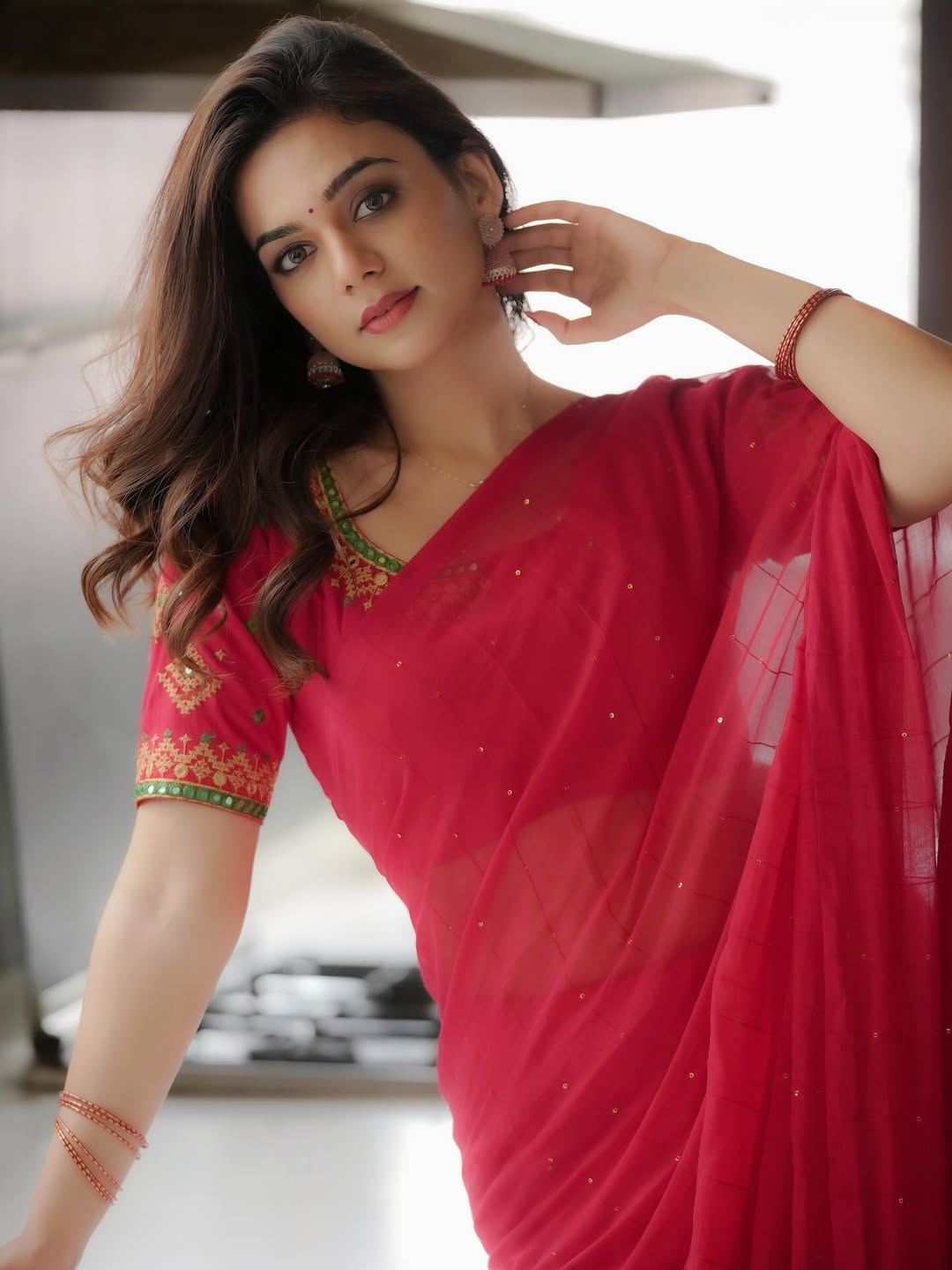 Bhavya Trikha Bold Red Saree Navel Show Look