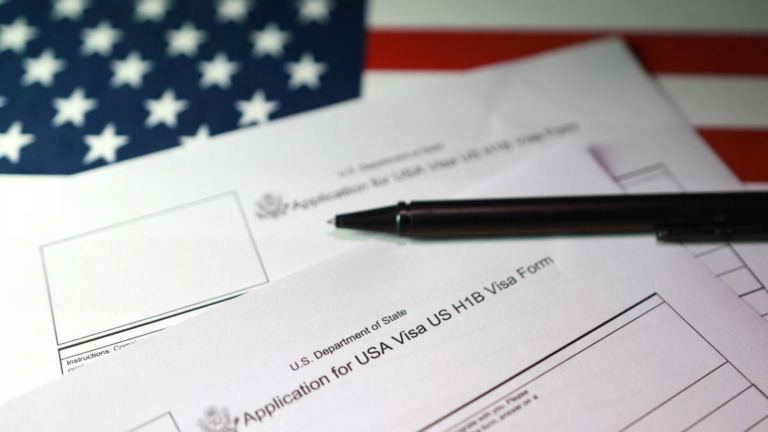 H-1B extension travel status issue