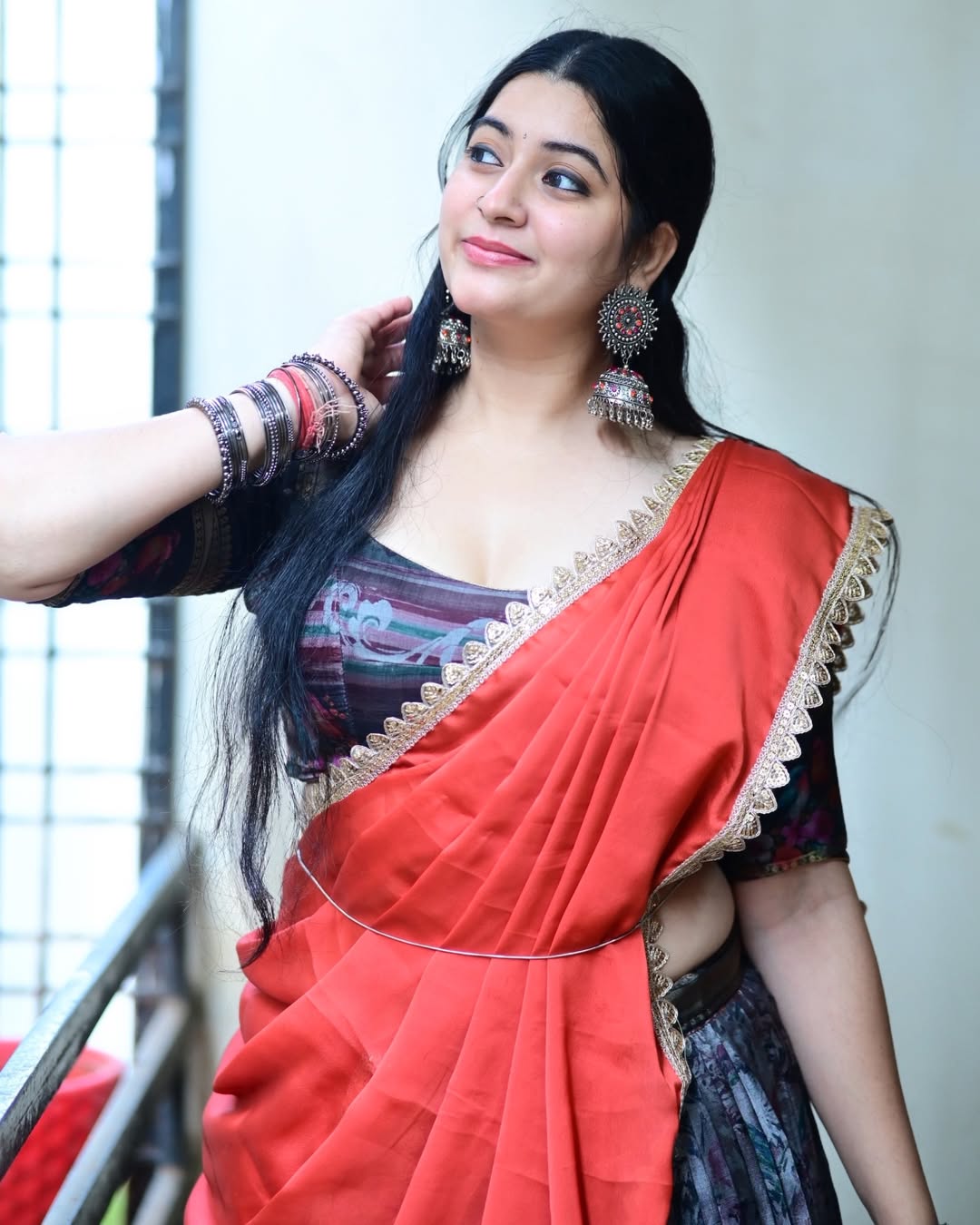 K Sudha In Traditional Blouse And Silver Jhumka.