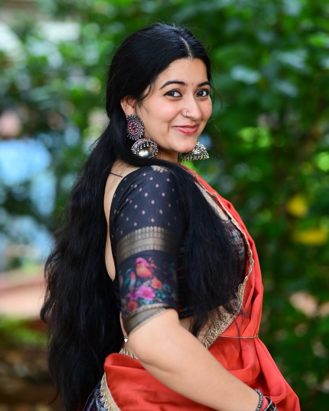 K Sudha Radiant Smile In Red Saree Look Online.