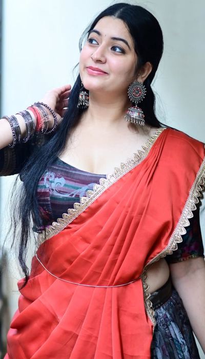 Elegant Profile Shot Of K Sudha In Red Saree.