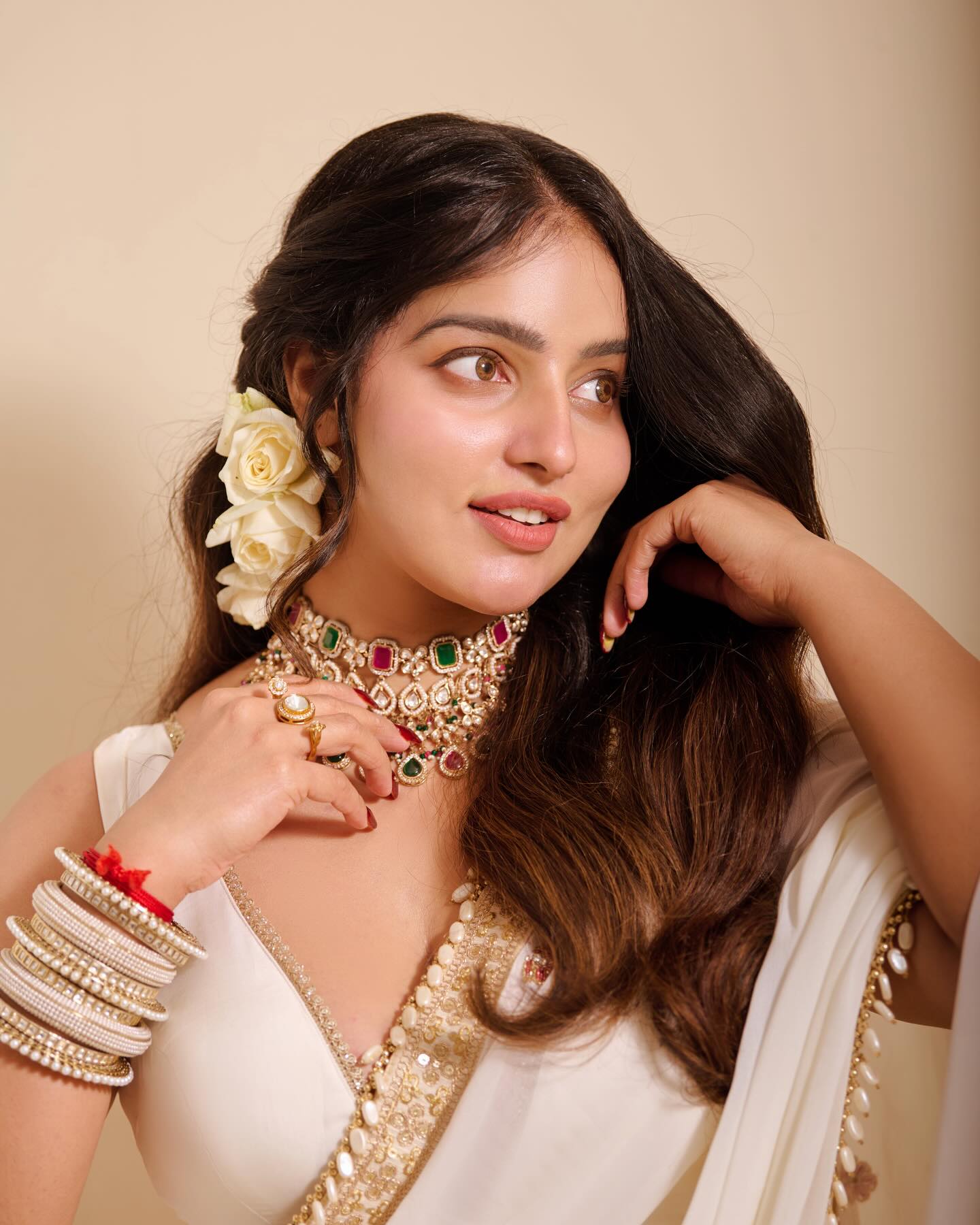 Malavika Menon Graceful Pose In Elegant Ivory Saree