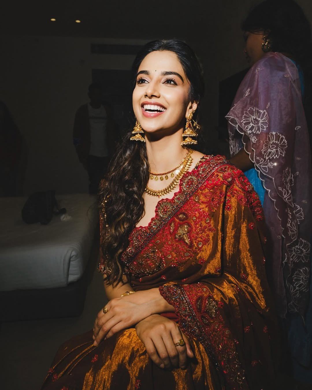 Meenakshi Chaudhary Radiant Smile In Gold Saree.