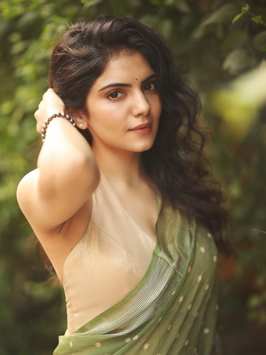 Misha Narang Poses Confidently In A Green Saree.