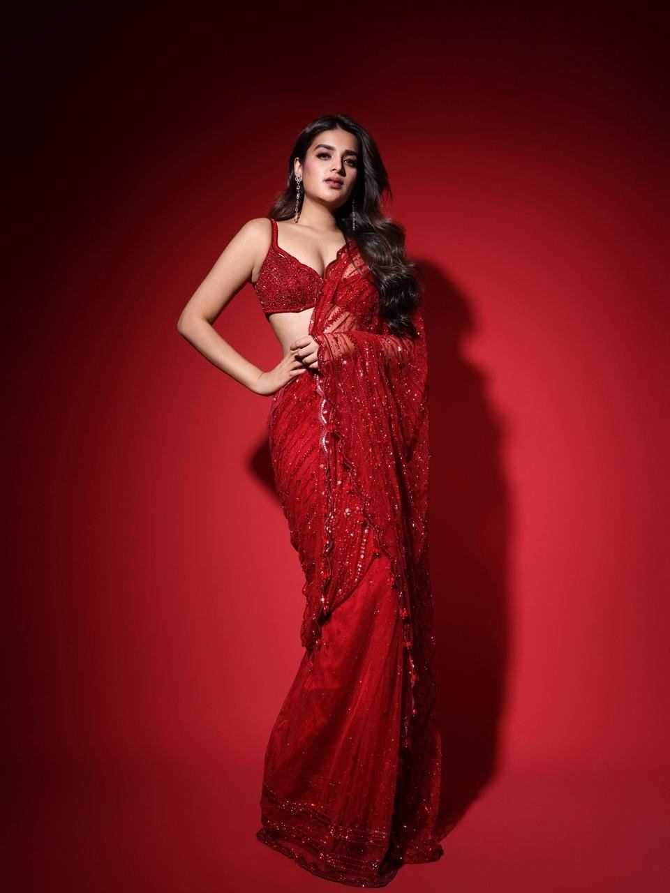 Nidhhi Agerwal Posing In Bold Red Sequin Saree