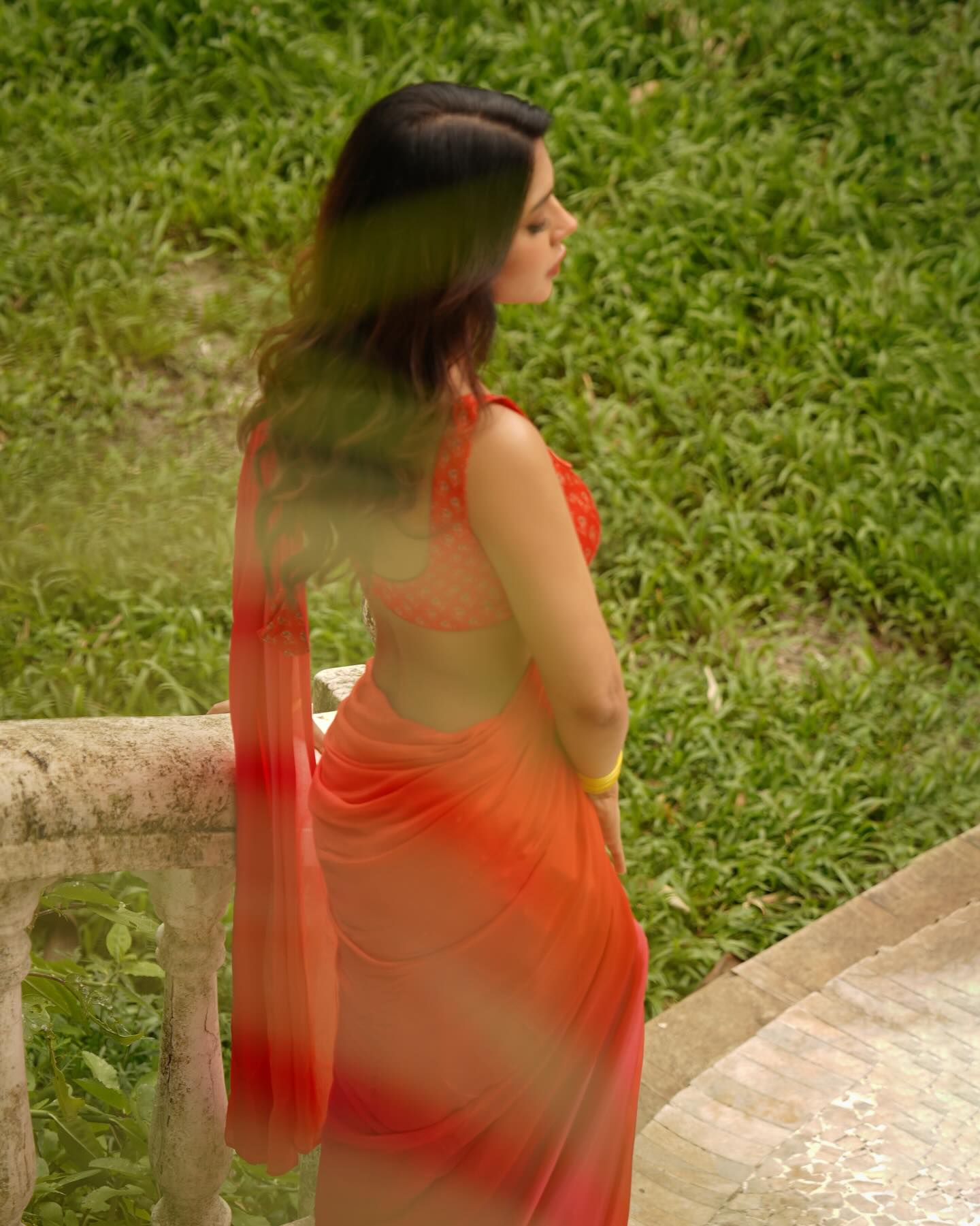 Ruhi Singh elegant red saree look closeup shot