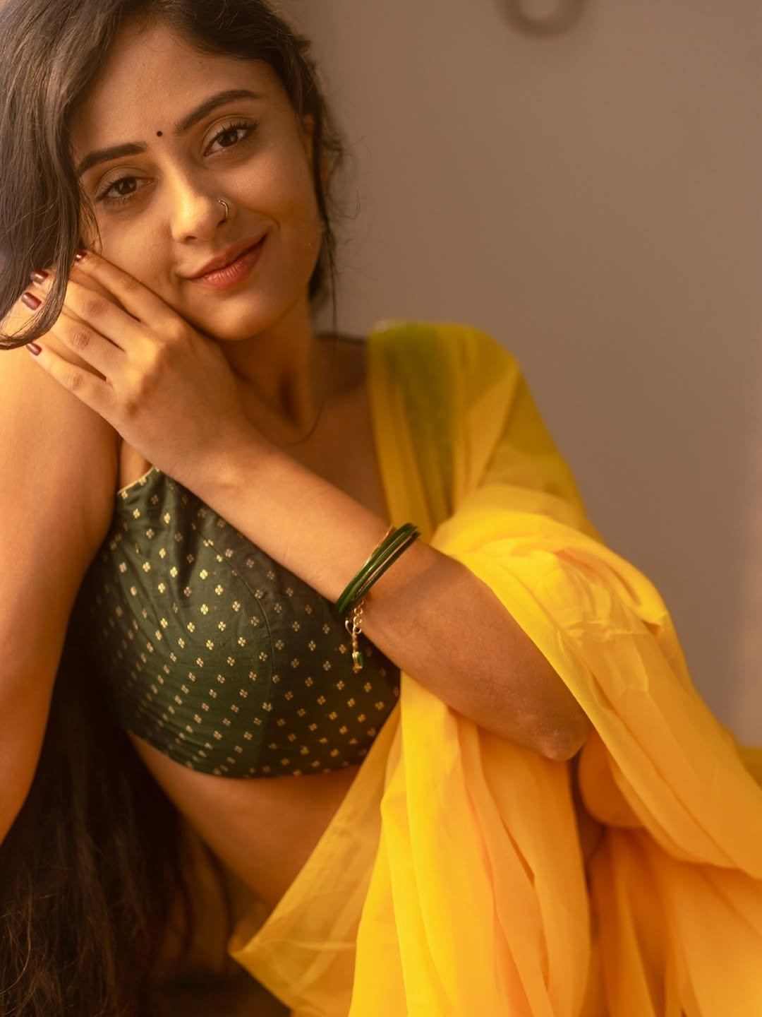Sanya Thakur Sitting Pose In Yellow Saree