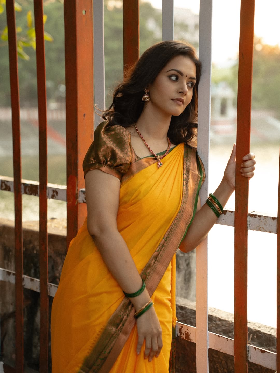 Swathishta Krishnan Yellow Saree Grill Pose Pic