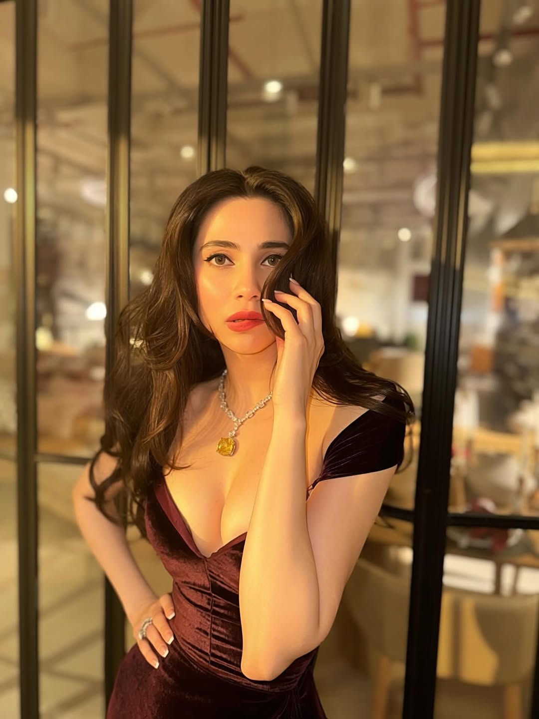 Zara Khan In Bold Maroon Velvet Slit Gown Posing