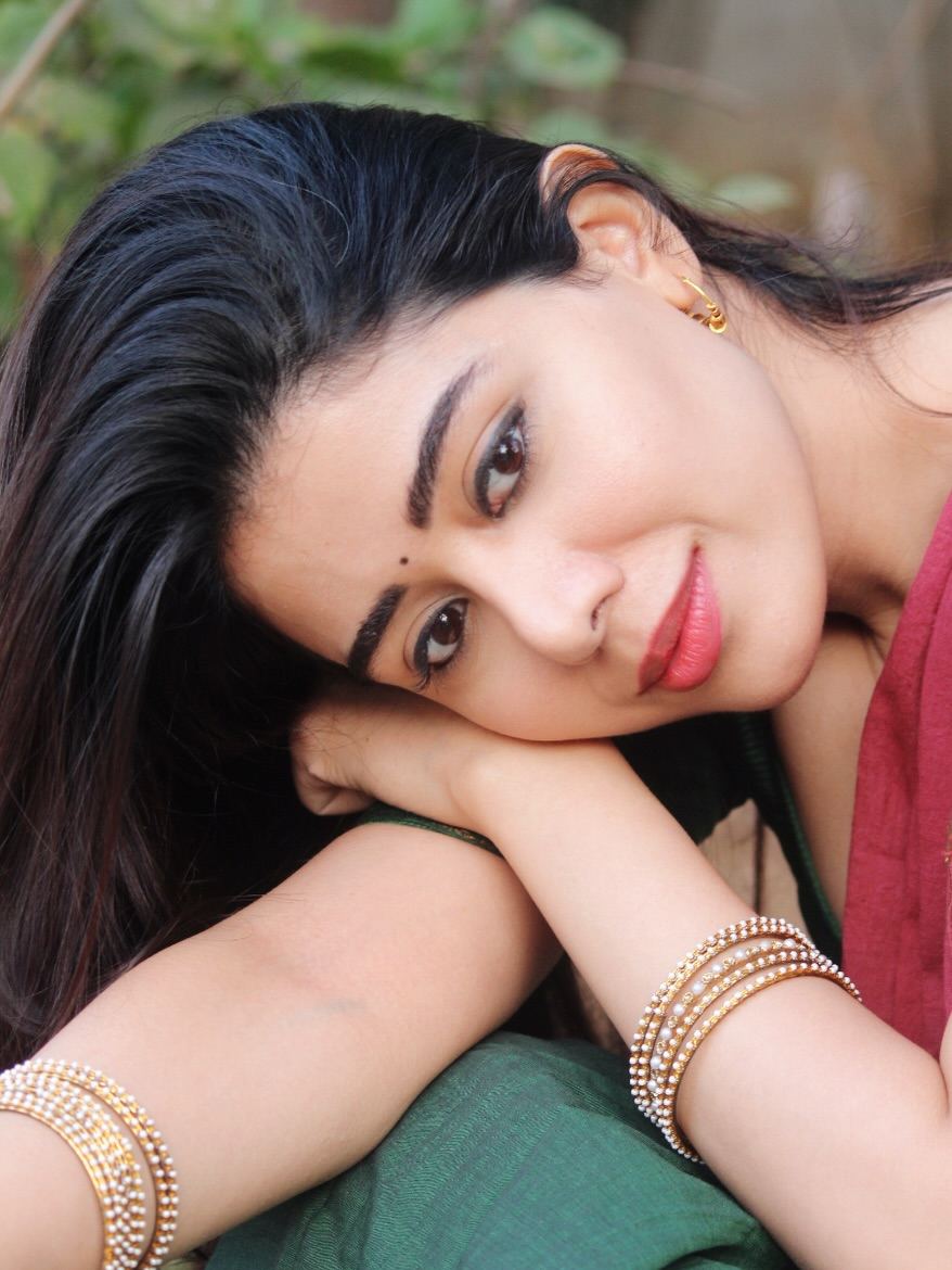 Aarti Chhikara Resting Gracefully Against Trees