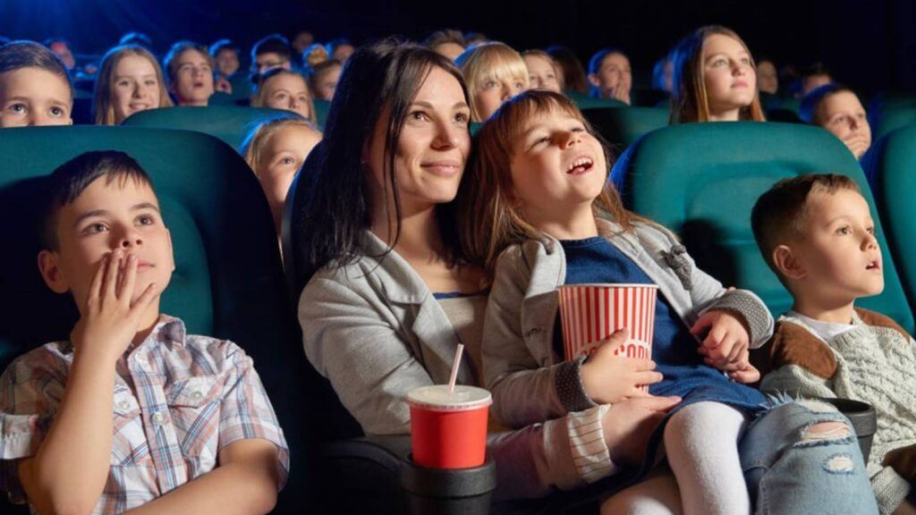 Children watching movie in theatre