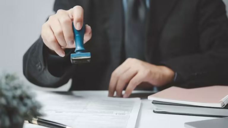 H-1B worker reviewing layoff documents