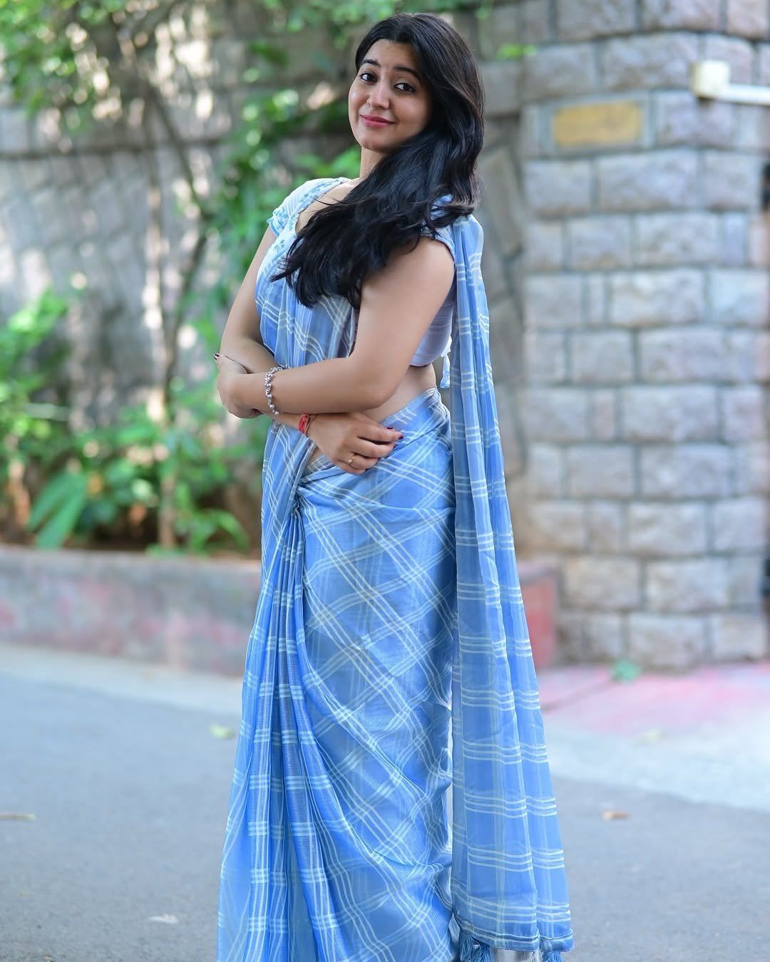 K Sudha Posing Confidently In Blue Saree Drape