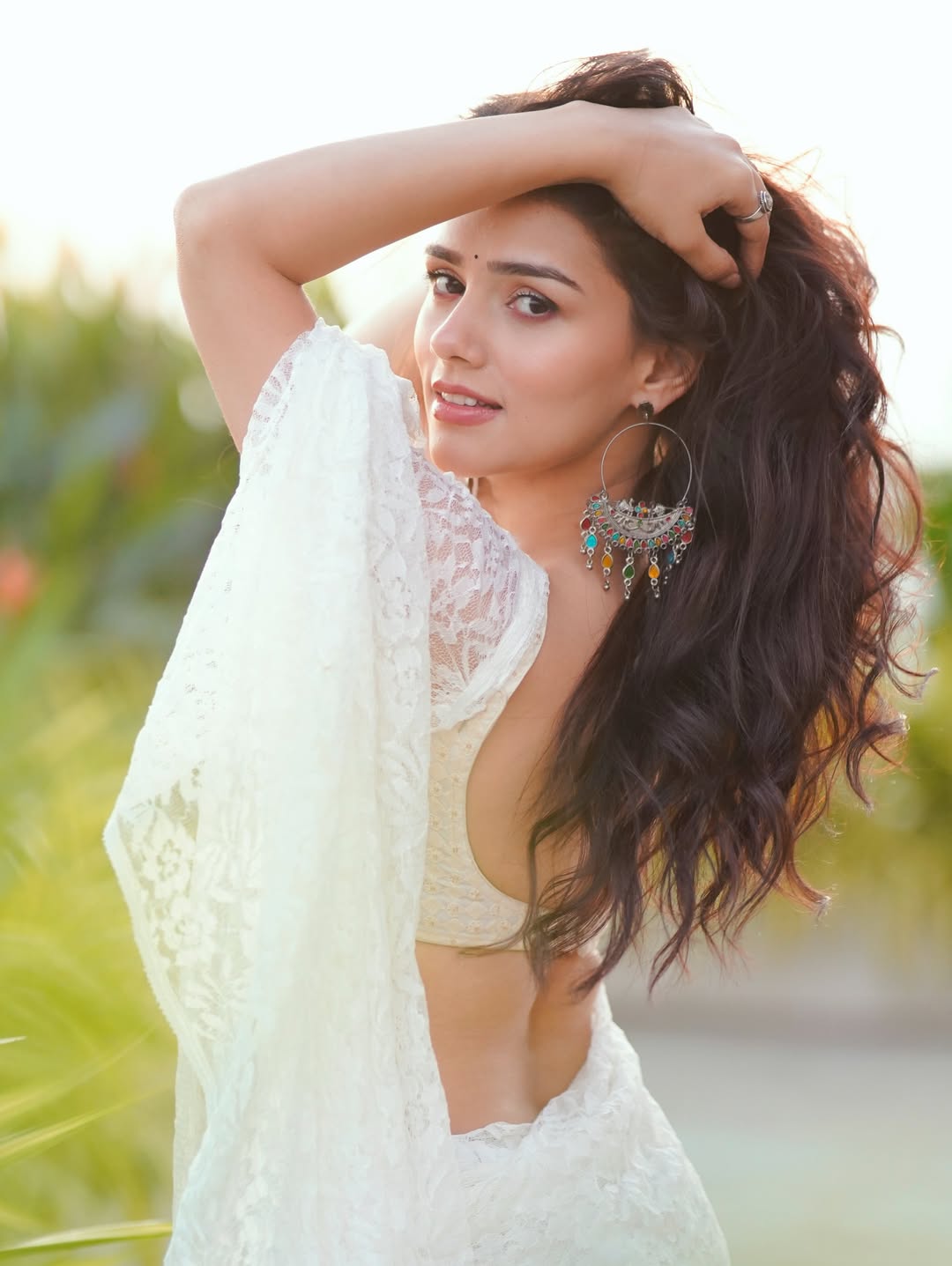 Nishi Saxena Posing In A Bold White Lace Saree