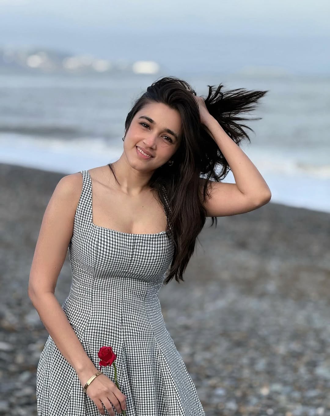 Nuveksha Holding Red Rose On Beach Shore