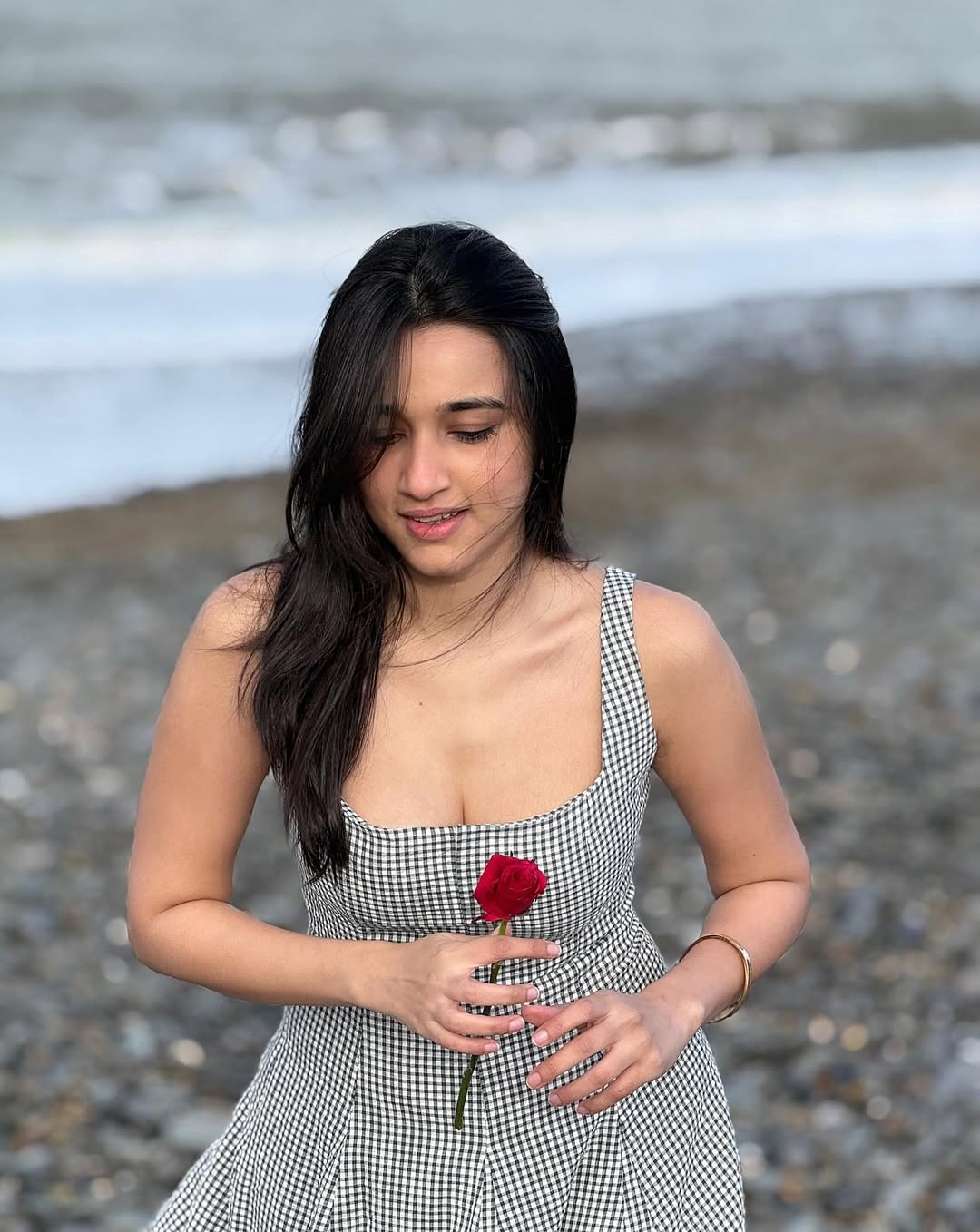 Nuveksha Windy Beach Hair Flip Pose