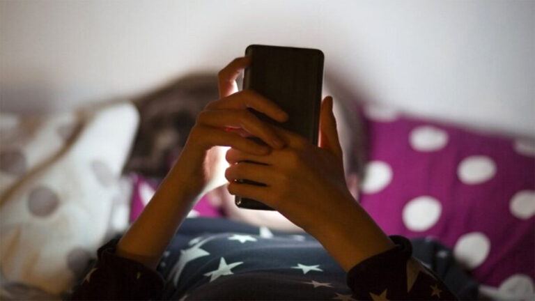 Person scrolling reels on phone